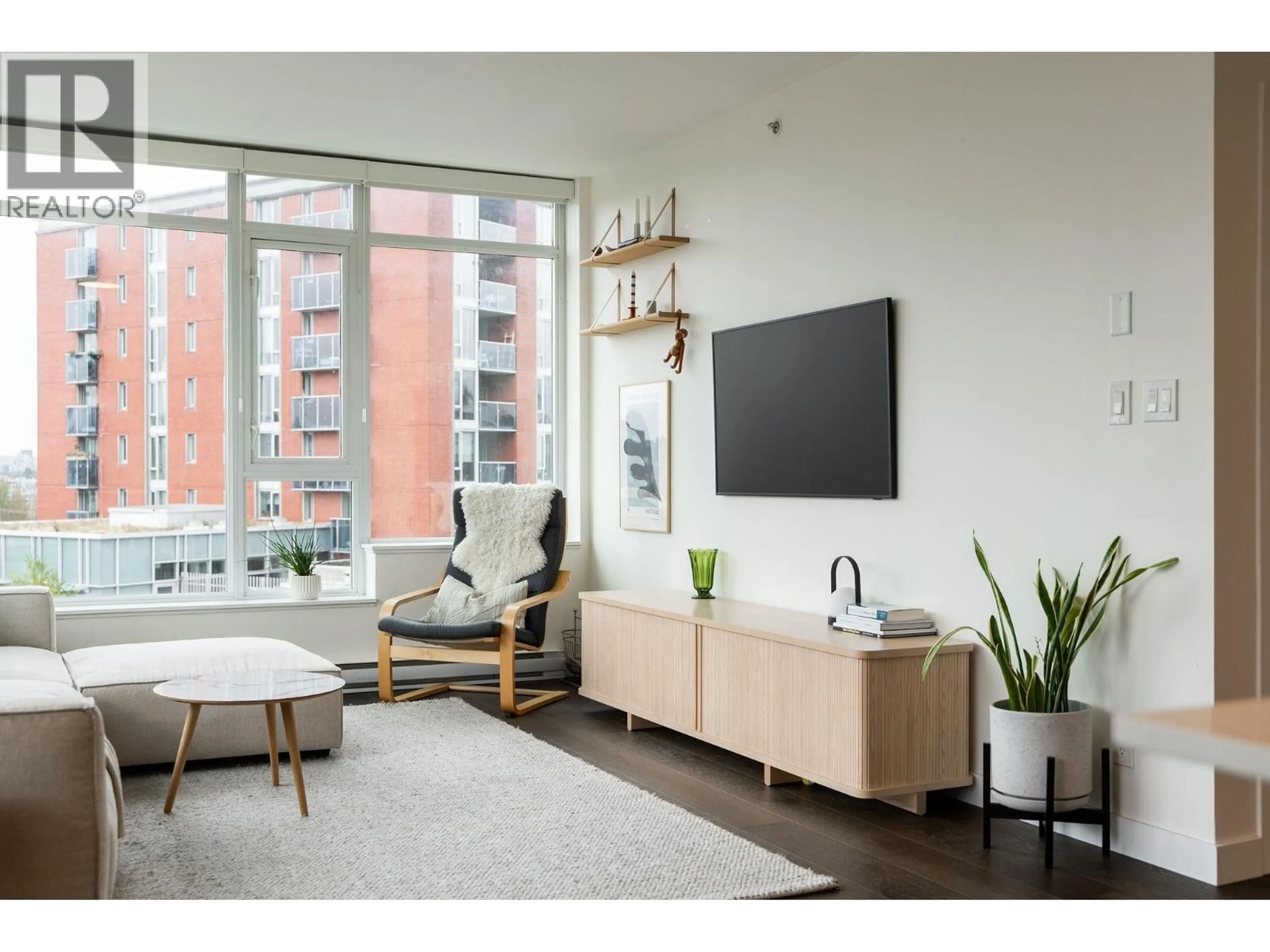 Living room with furniture, wood/laminate floor for 709 - 2321 SCOTIA STREET, Vancouver British Columbia V5T0A8