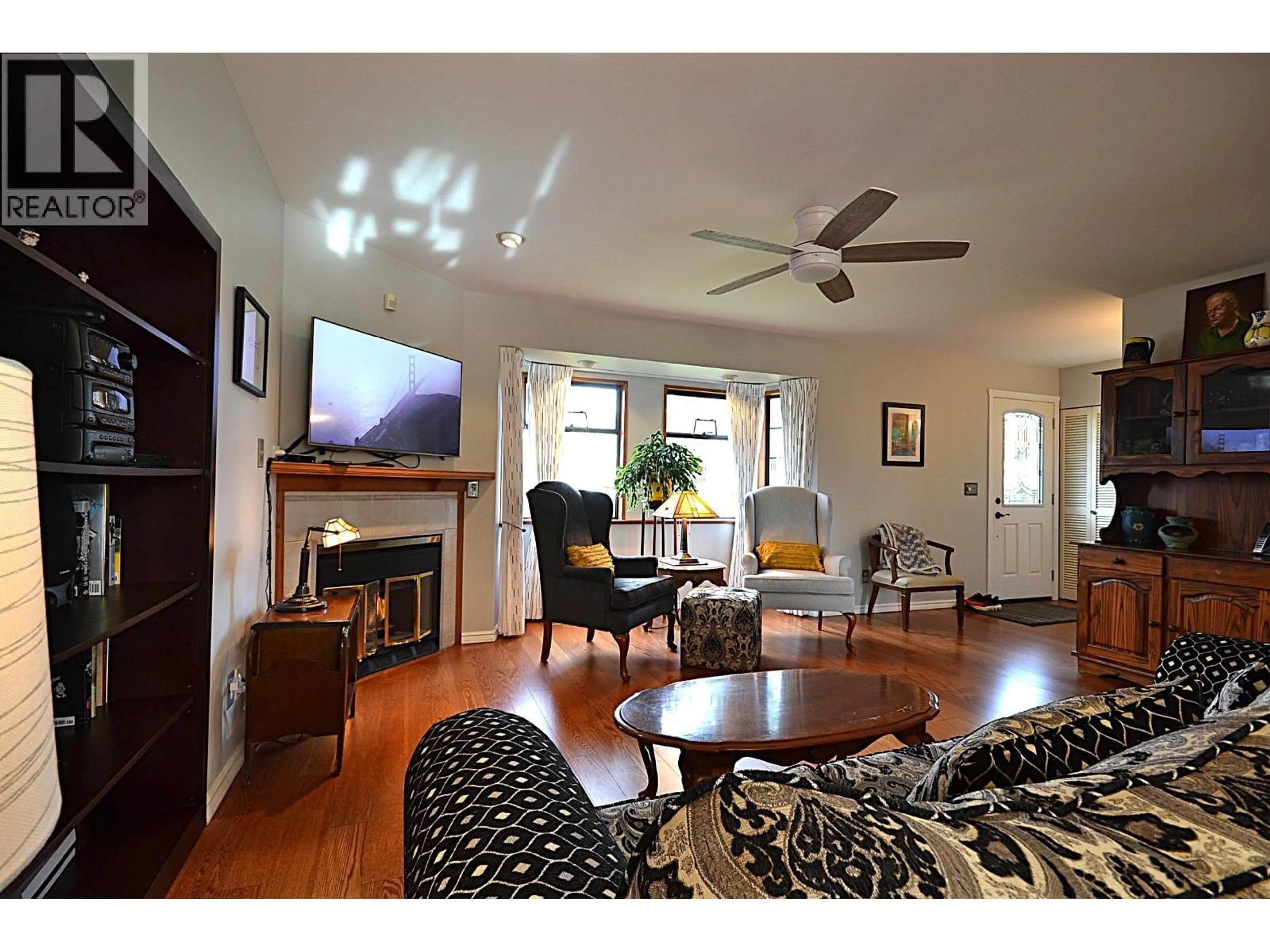 Living room with furniture, wood/laminate floor for 3578 HAIDA DRIVE, Vancouver British Columbia V5M3Z4