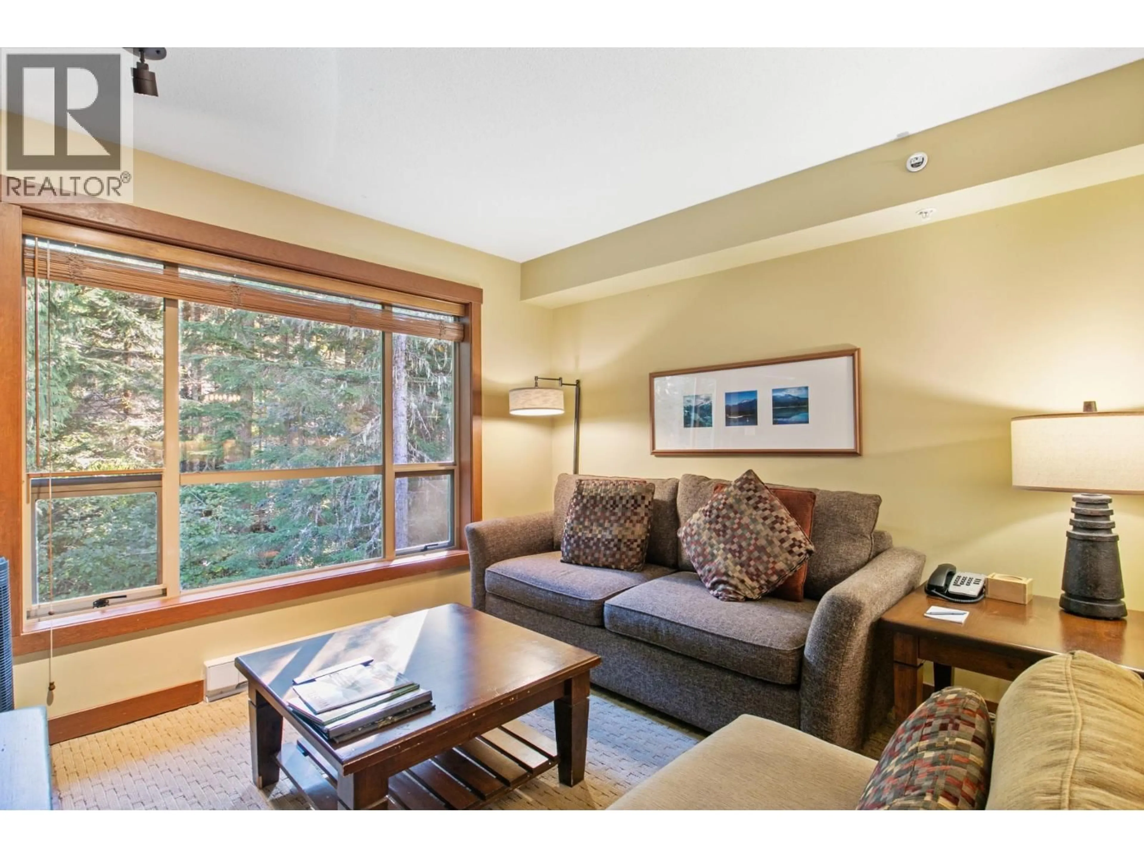 Living room with furniture, wood/laminate floor for 405 G4 - 4653 BLACKCOMB WAY, Whistler British Columbia V8E0Y9