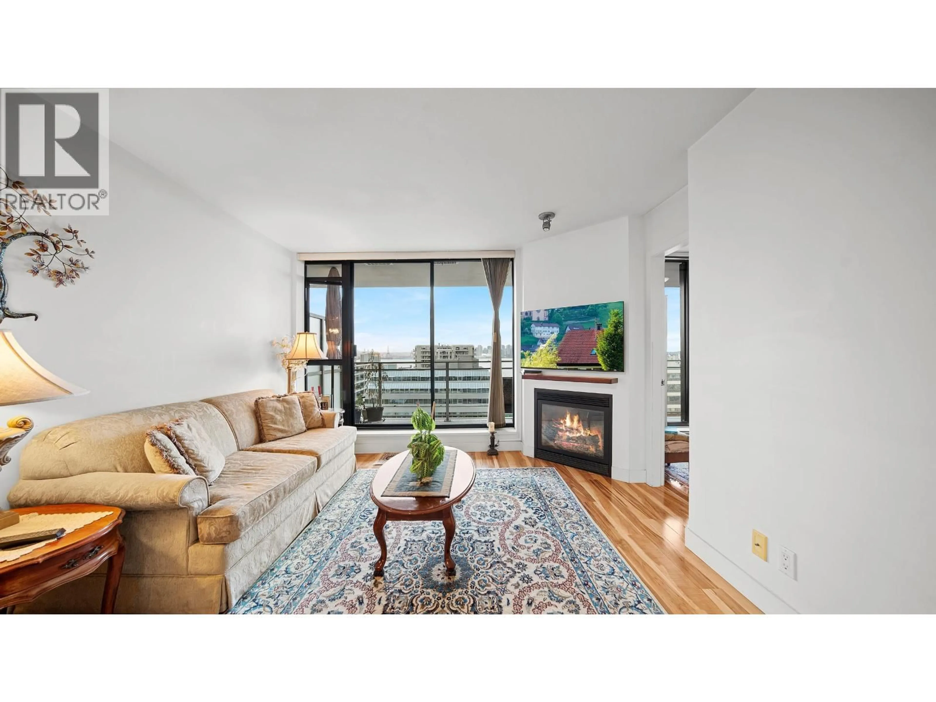 Living room with furniture, wood/laminate floor for 810 - 175 1ST STREET, North Vancouver British Columbia V7M3N9