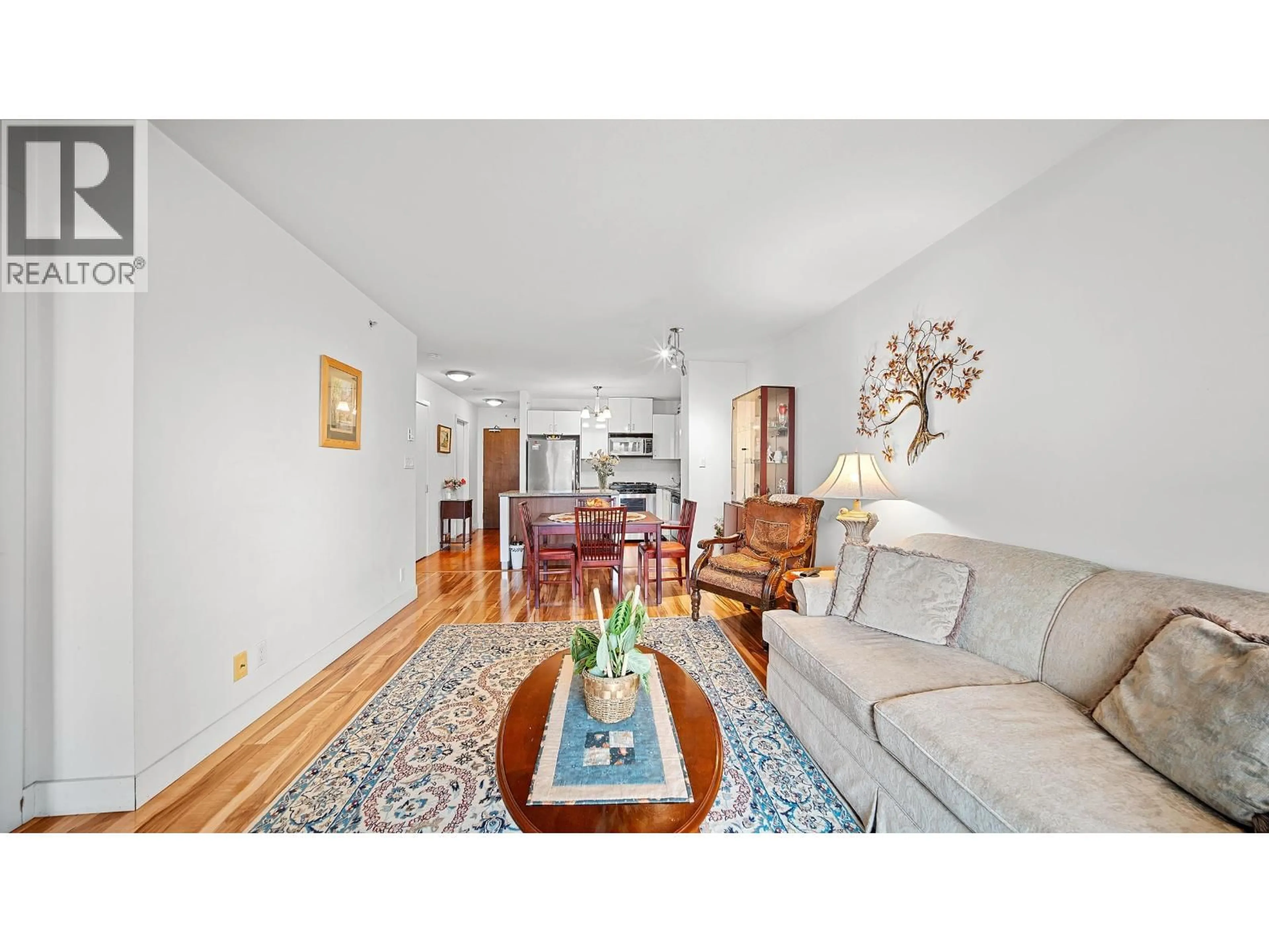 Living room with furniture, wood/laminate floor for 810 - 175 1ST STREET, North Vancouver British Columbia V7M3N9