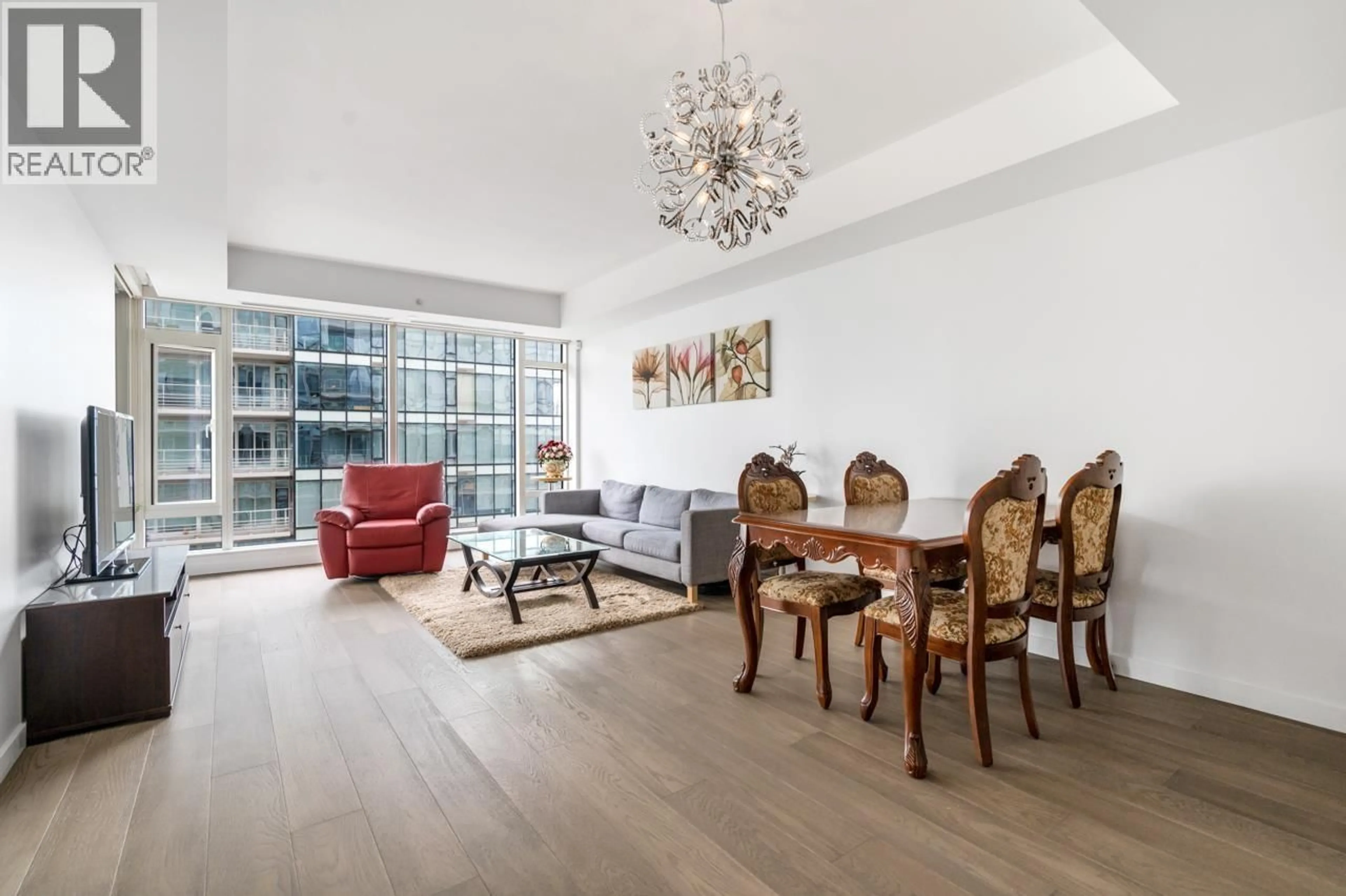 Living room with furniture, wood/laminate floor for 705 - 5177 BRIGHOUSE WAY, Richmond British Columbia V7C0A7