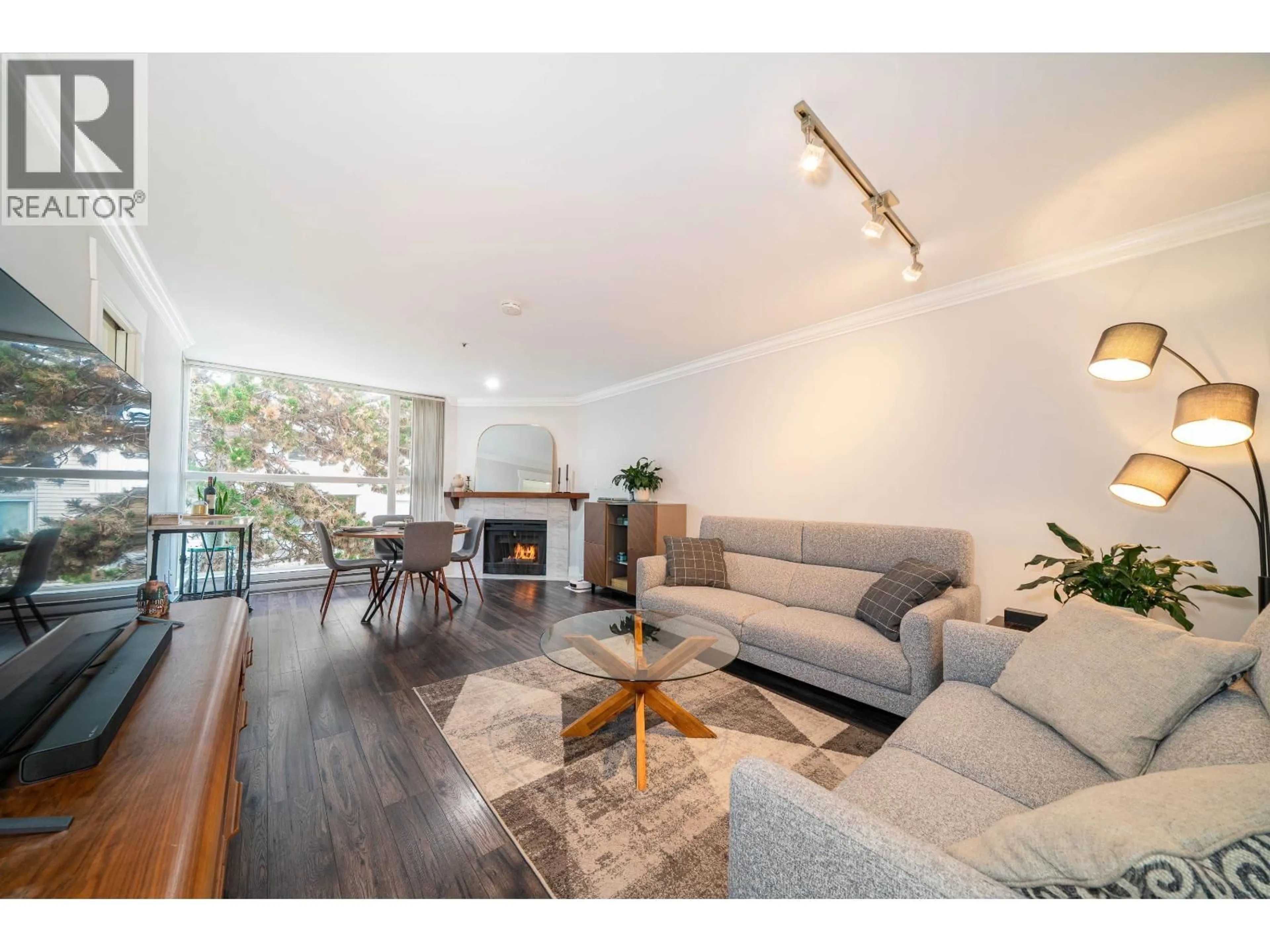 Living room with furniture, wood/laminate floor for 304 - 7700 GILBERT ROAD, Richmond British Columbia V7C3W2
