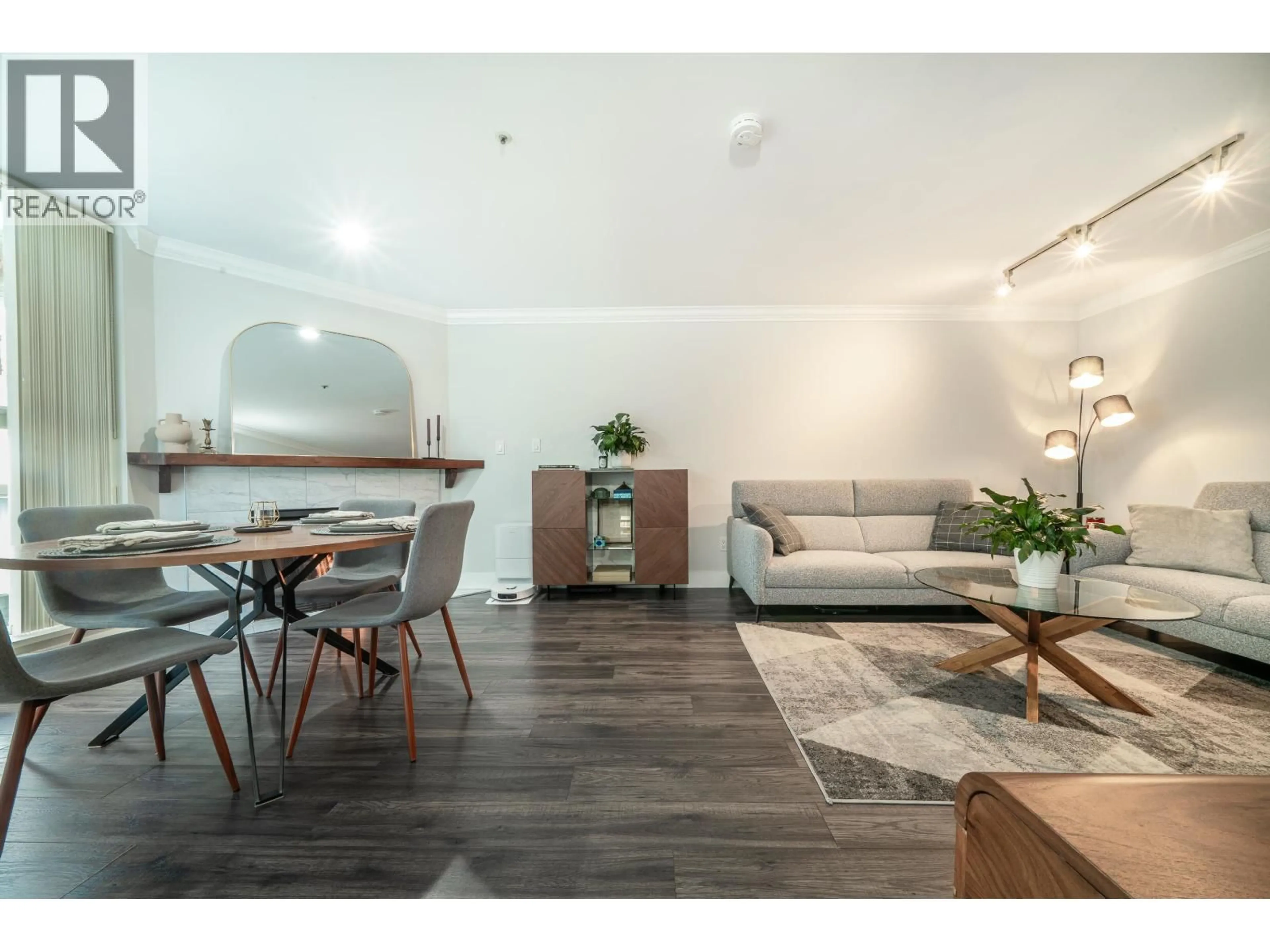 Living room with furniture, wood/laminate floor for 304 - 7700 GILBERT ROAD, Richmond British Columbia V7C3W2