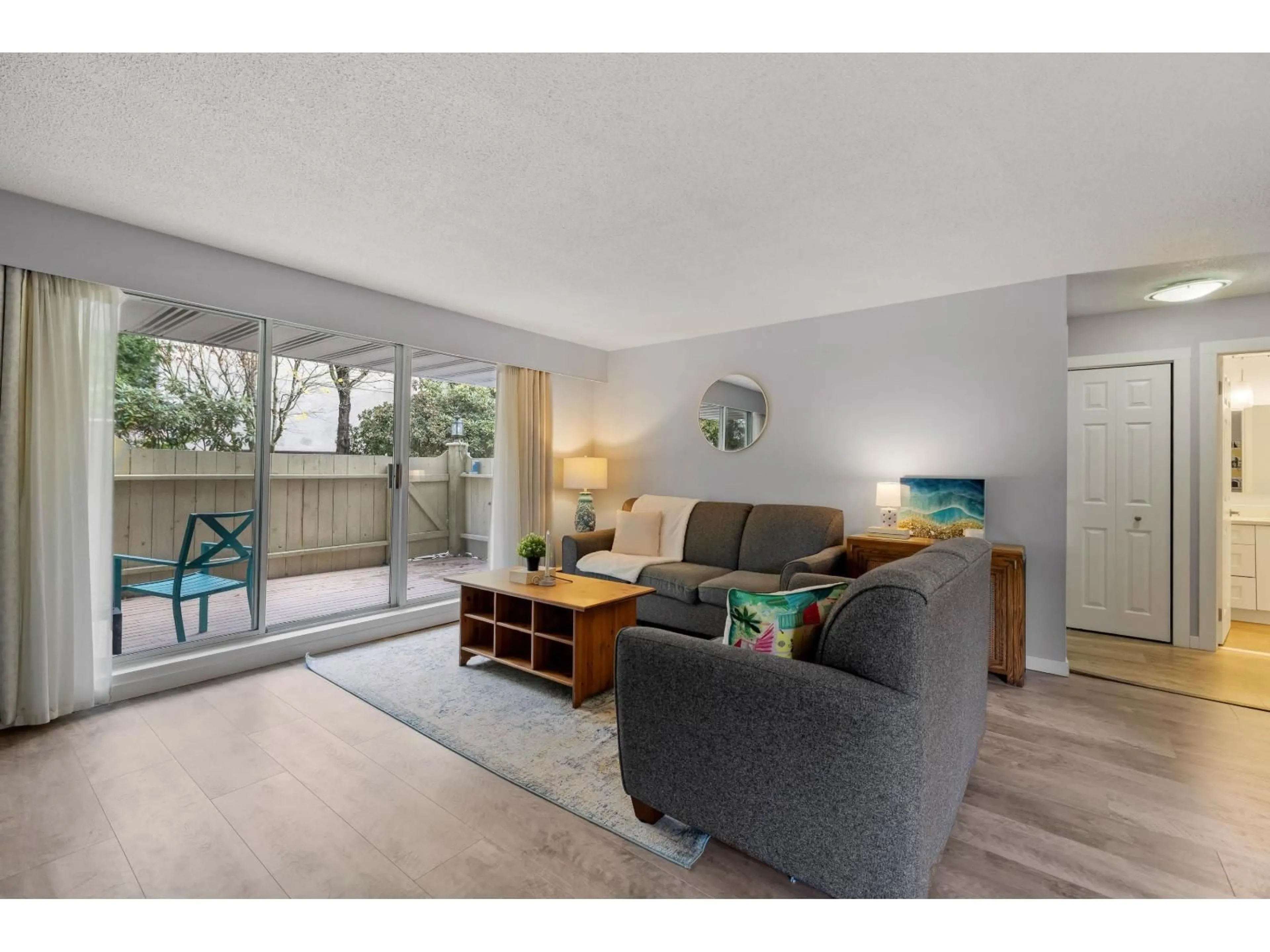 Living room with furniture, wood/laminate floor for 206 - 15010 ROPER, White Rock British Columbia V4B5A9