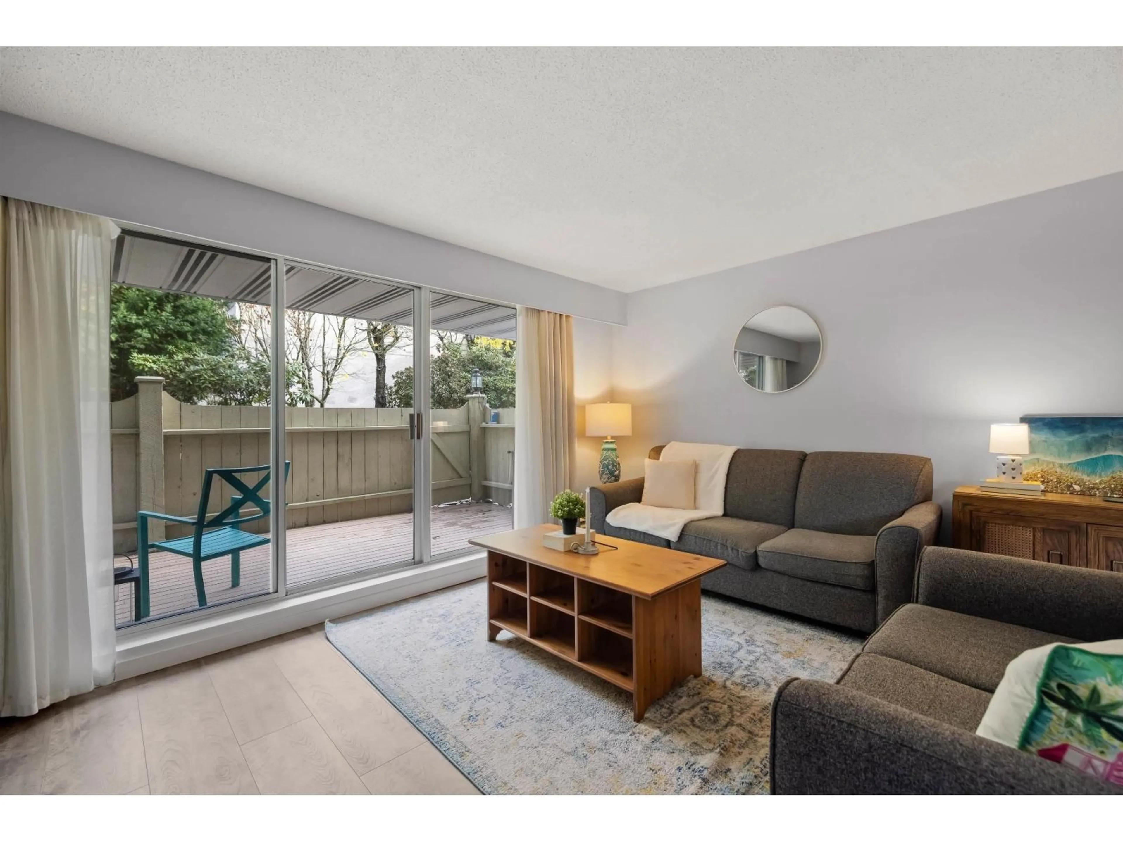 Living room with furniture, wood/laminate floor for 206 - 15010 ROPER, White Rock British Columbia V4B5A9
