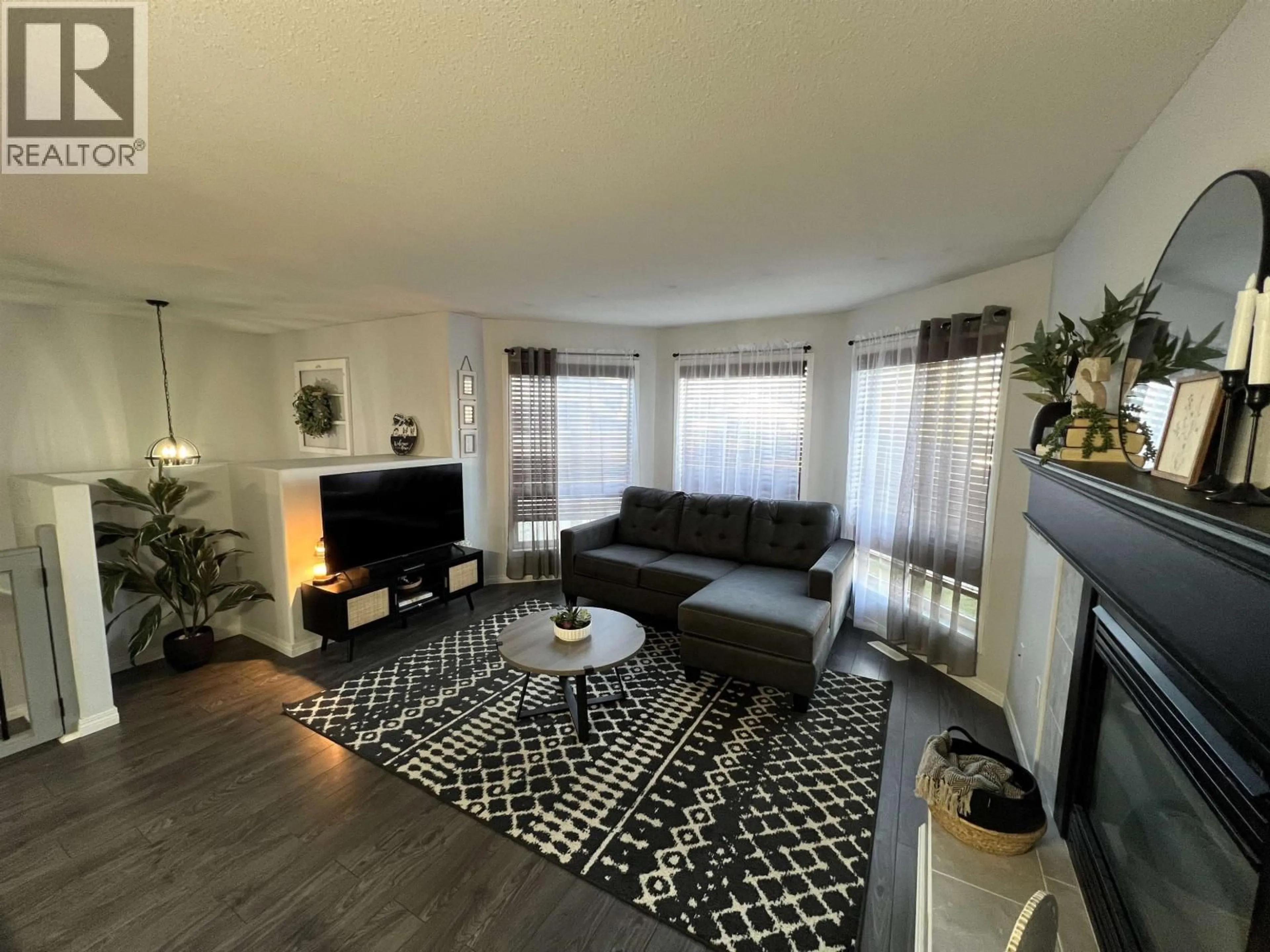 Living room with furniture, unknown for 5516 57 STREET, Fort Nelson British Columbia V0C1R0