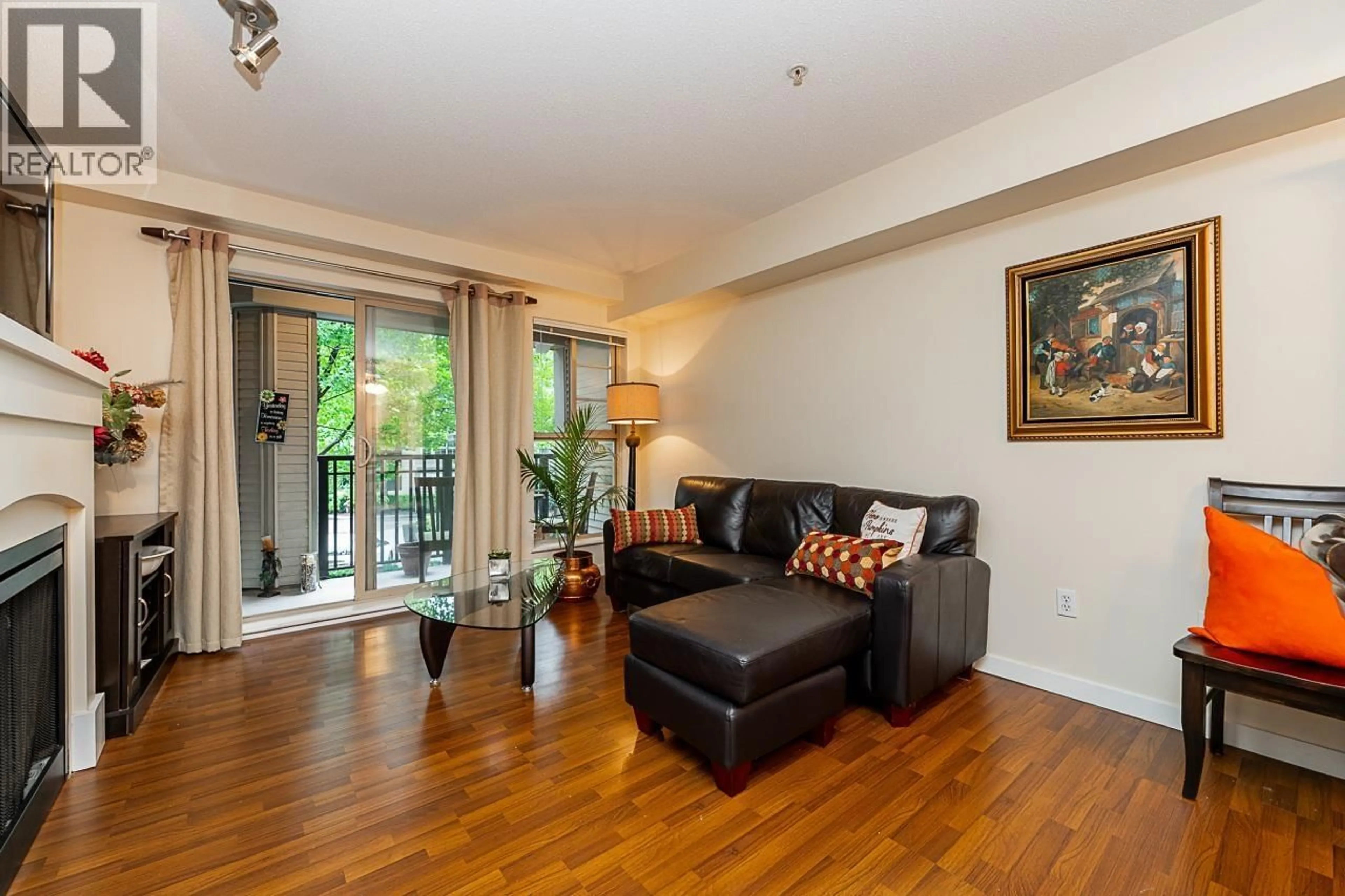 Living room with furniture, wood/laminate floor for 206 - 2958 SILVER SPRINGS BOULEVARD, Coquitlam British Columbia V3E3R9