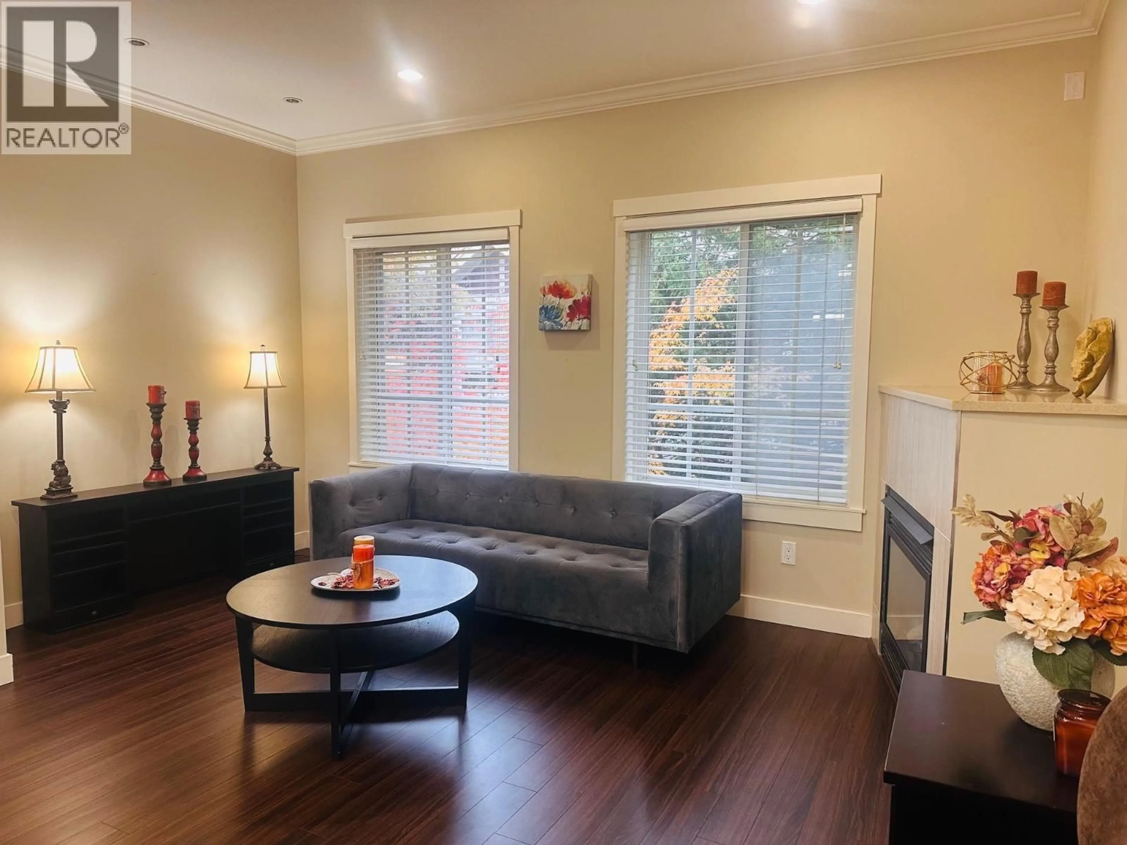 Living room with furniture, wood/laminate floor for 16 - 9811 FERNDALE ROAD, Richmond British Columbia V6Y1X4