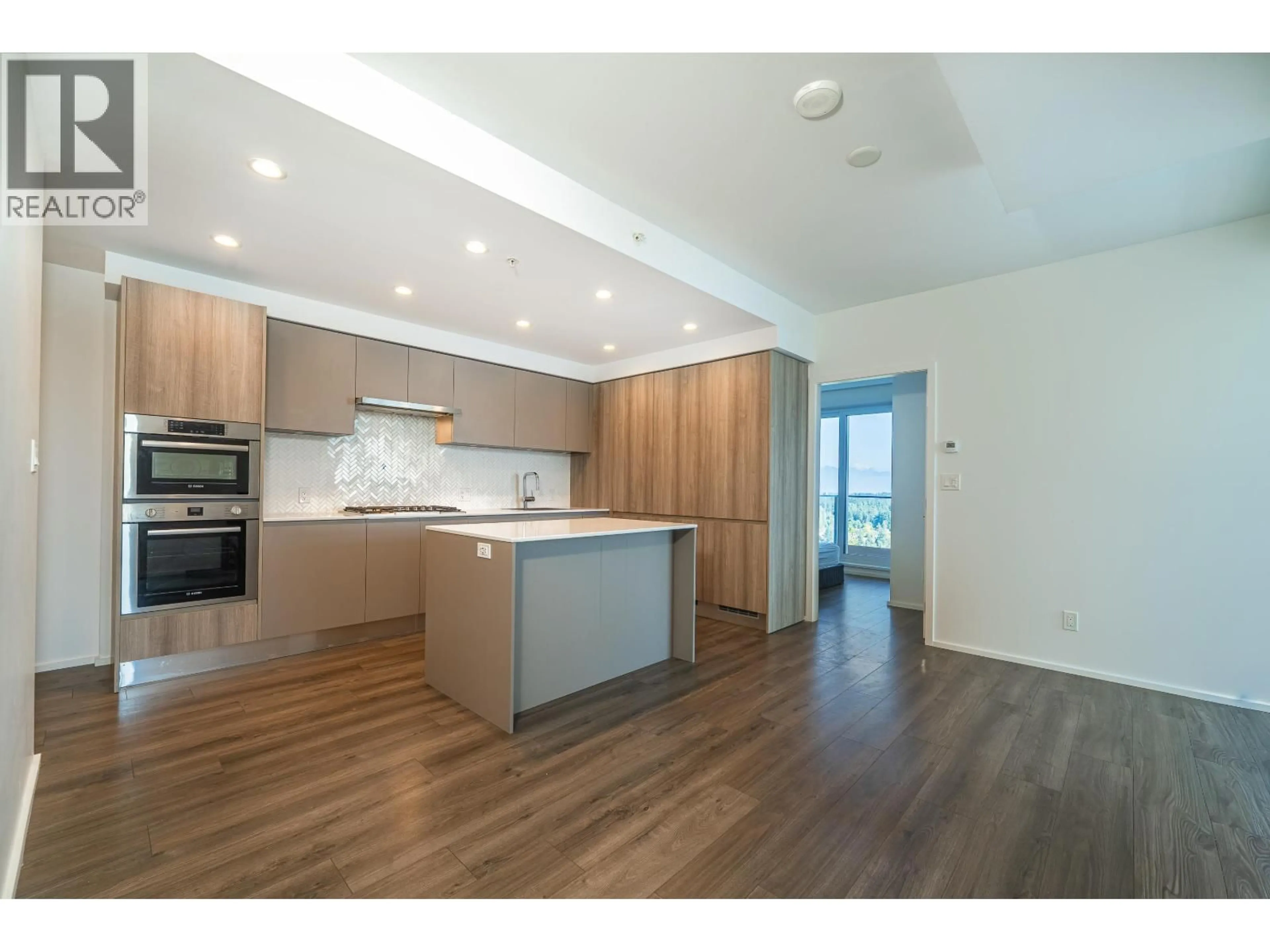 Open concept kitchen, wood/laminate floor for 5001 - 3809 EVERGREEN PLACE, Burnaby British Columbia V3J0M1
