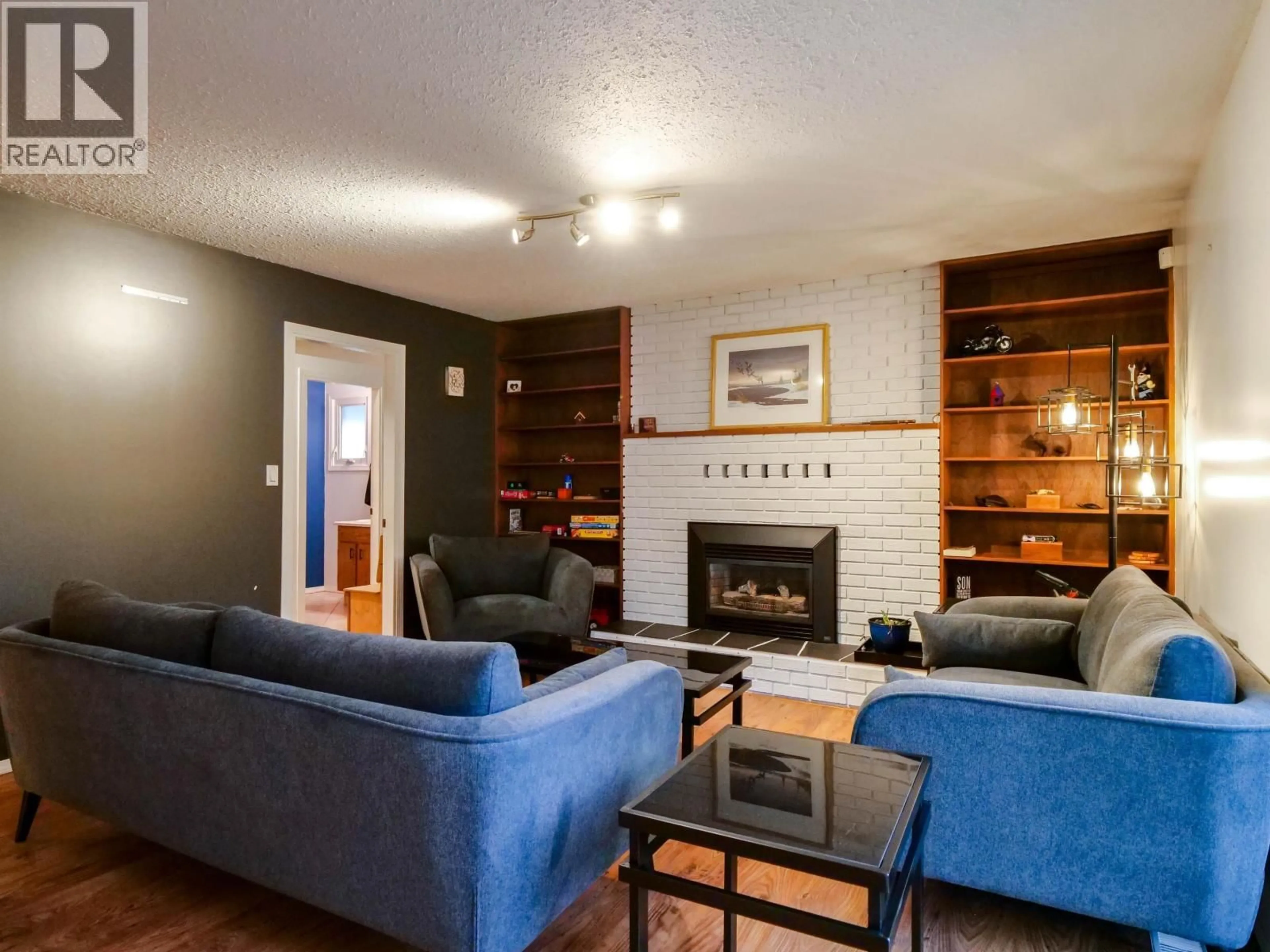 Living room with furniture, wood/laminate floor for 3050 BELCARRA ROAD, Quesnel British Columbia V2J5A9