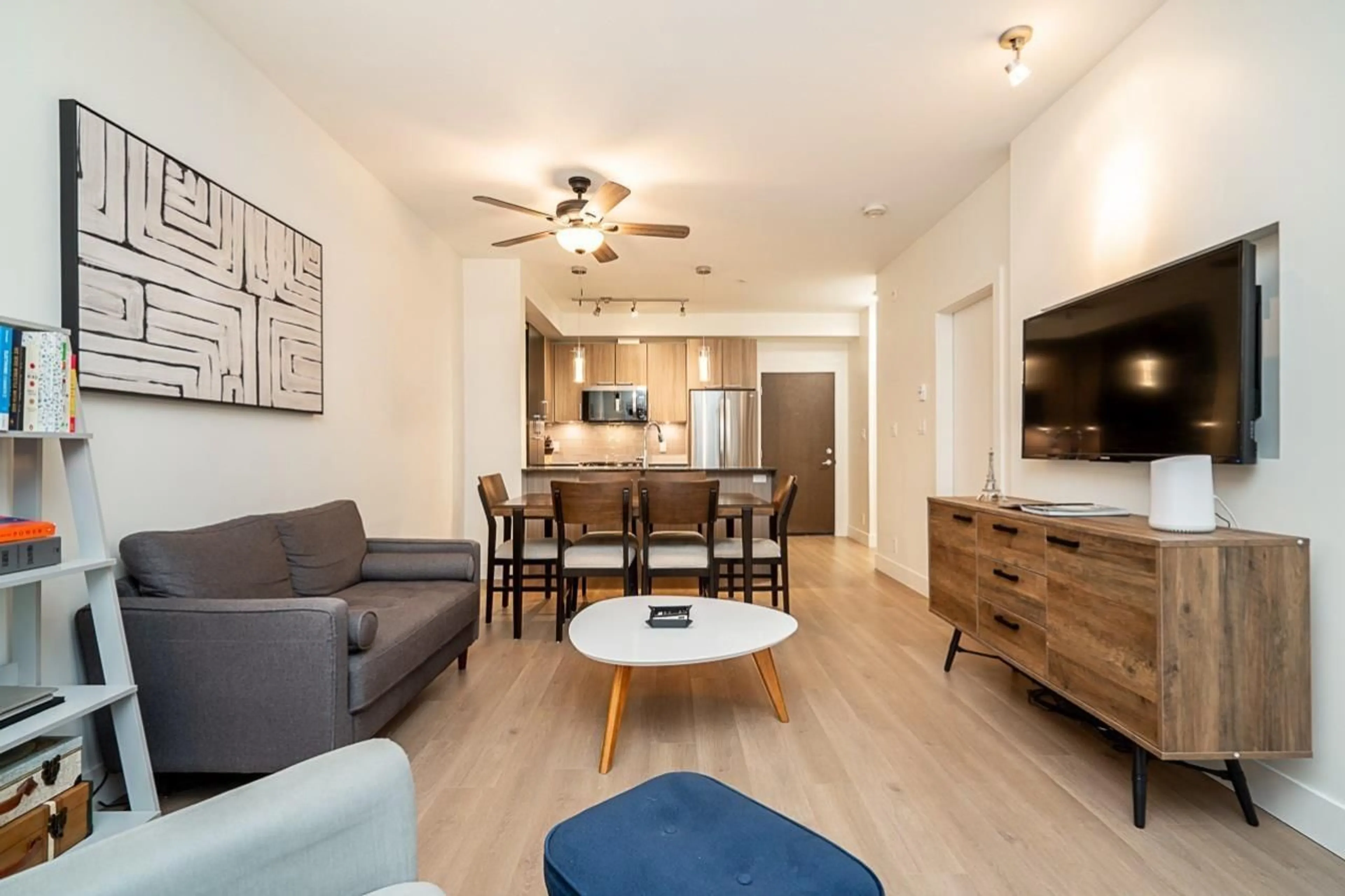 Living room with furniture, wood/laminate floor for B103 - 20211 66, Langley British Columbia V2Y0L4