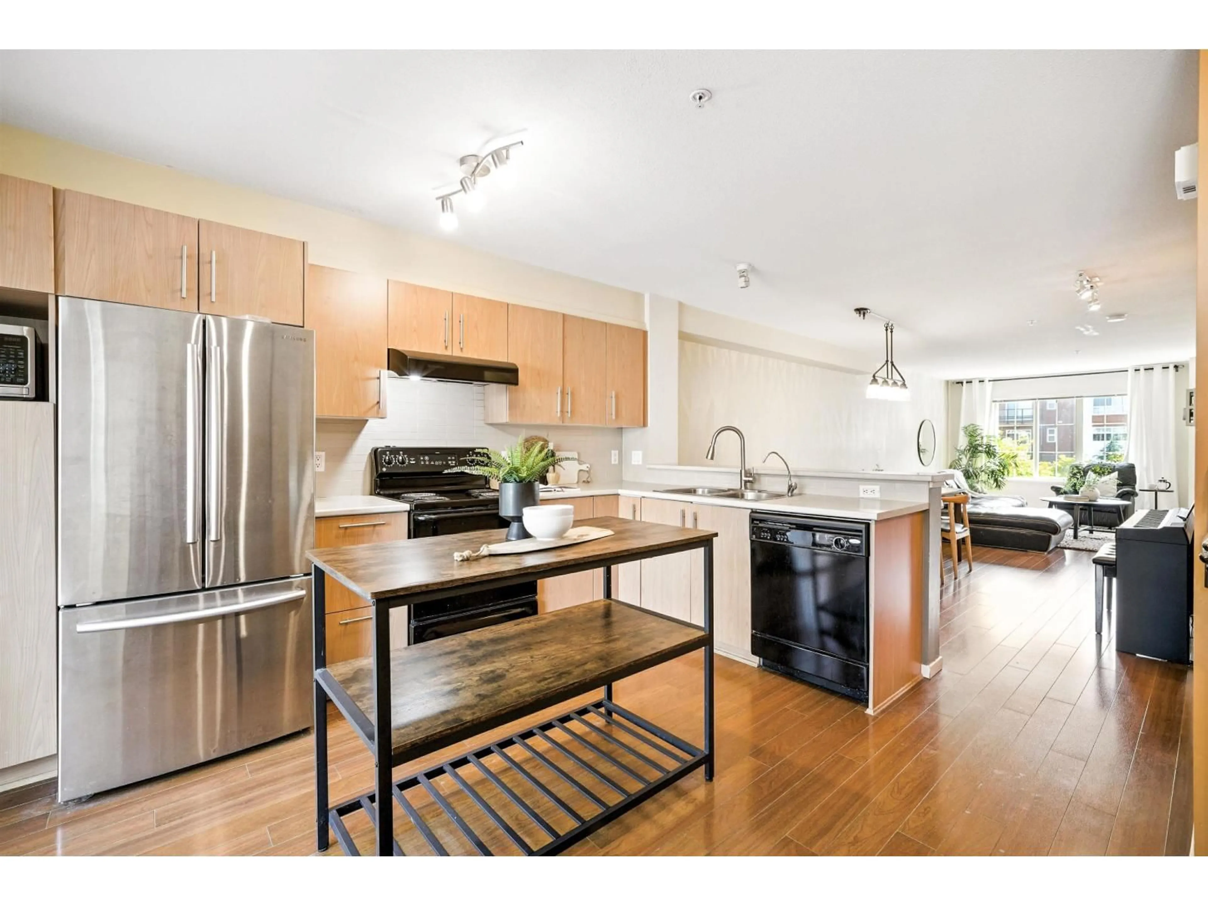 Open concept kitchen, wood/laminate floor for 51 - 20875 80, Langley British Columbia V2Y0B2