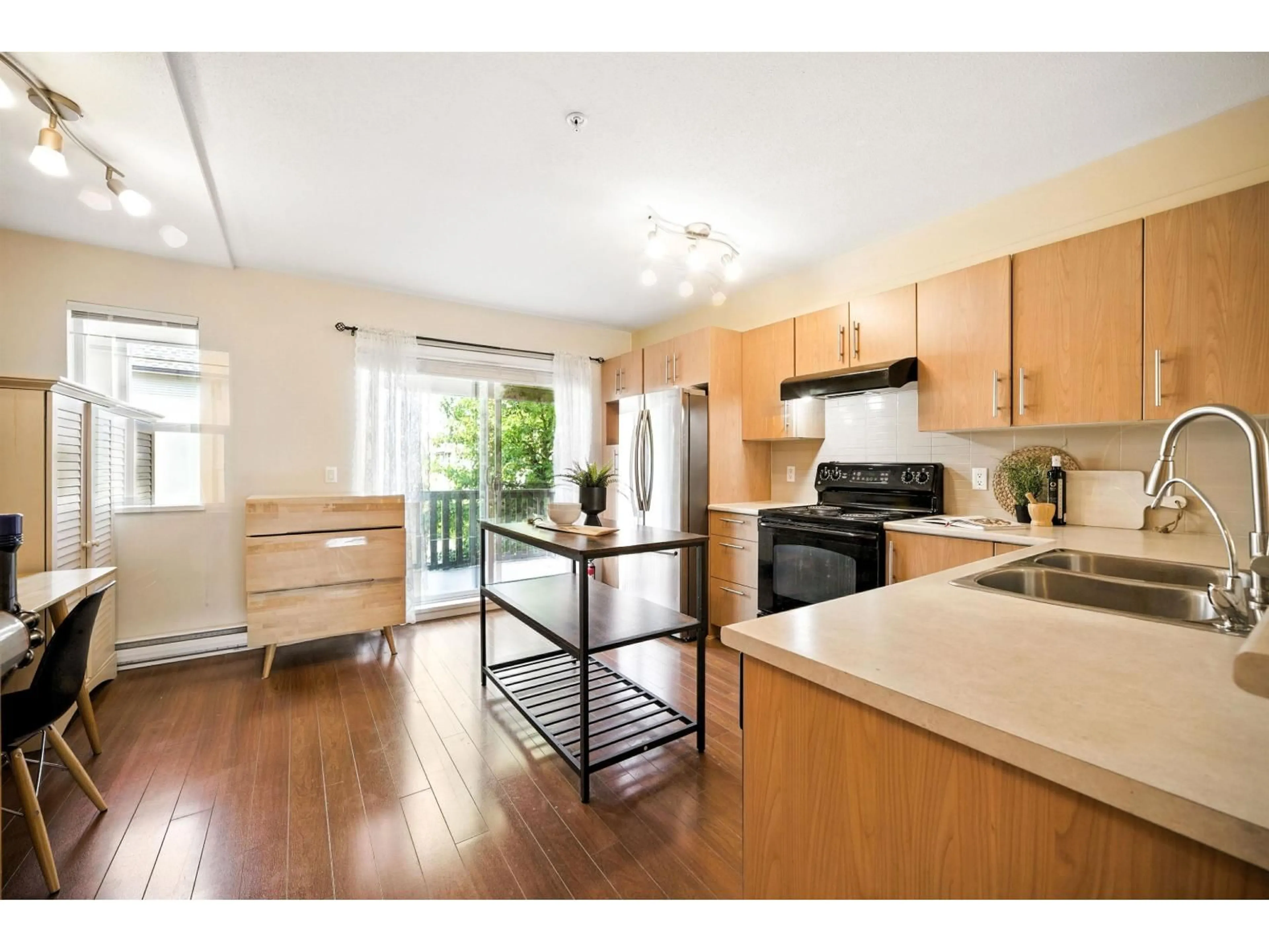 Open concept kitchen, wood/laminate floor for 51 - 20875 80, Langley British Columbia V2Y0B2