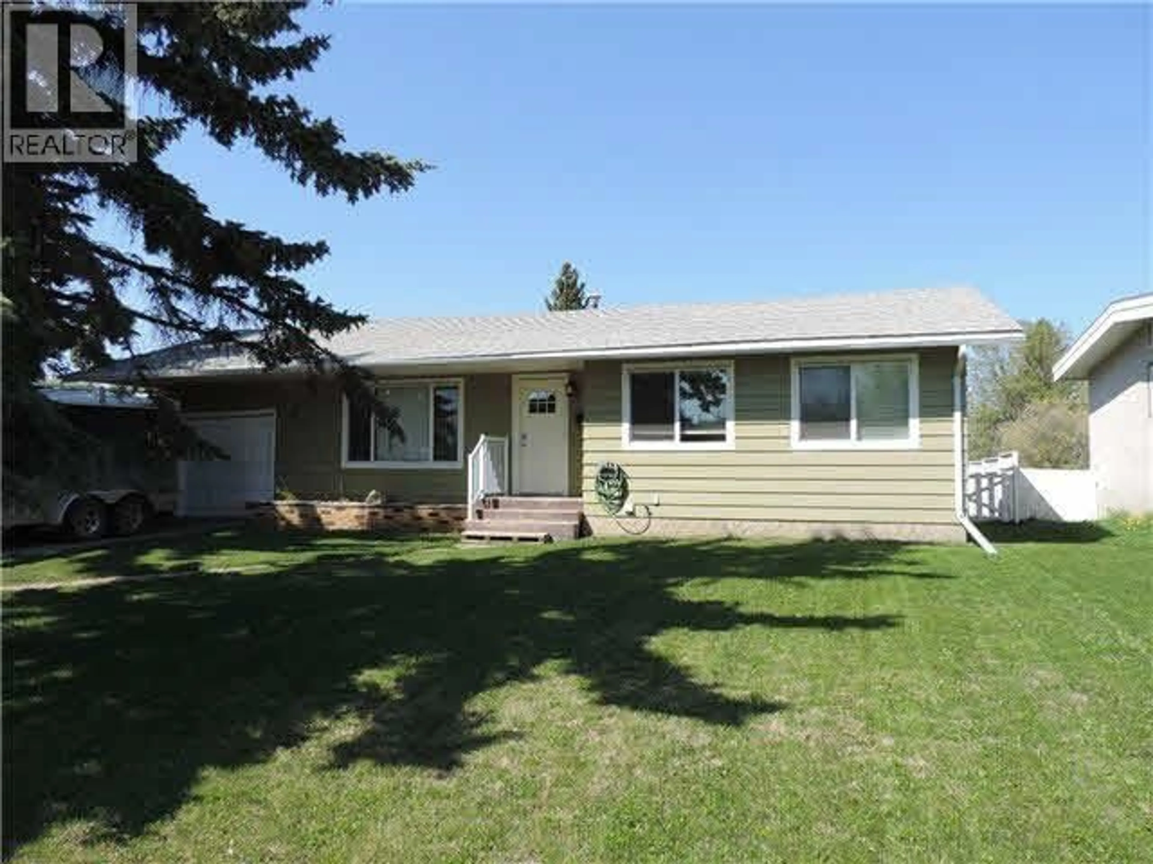 Home with vinyl exterior material, street for 9316 112 AVENUE, Fort St. John British Columbia V1J2V9