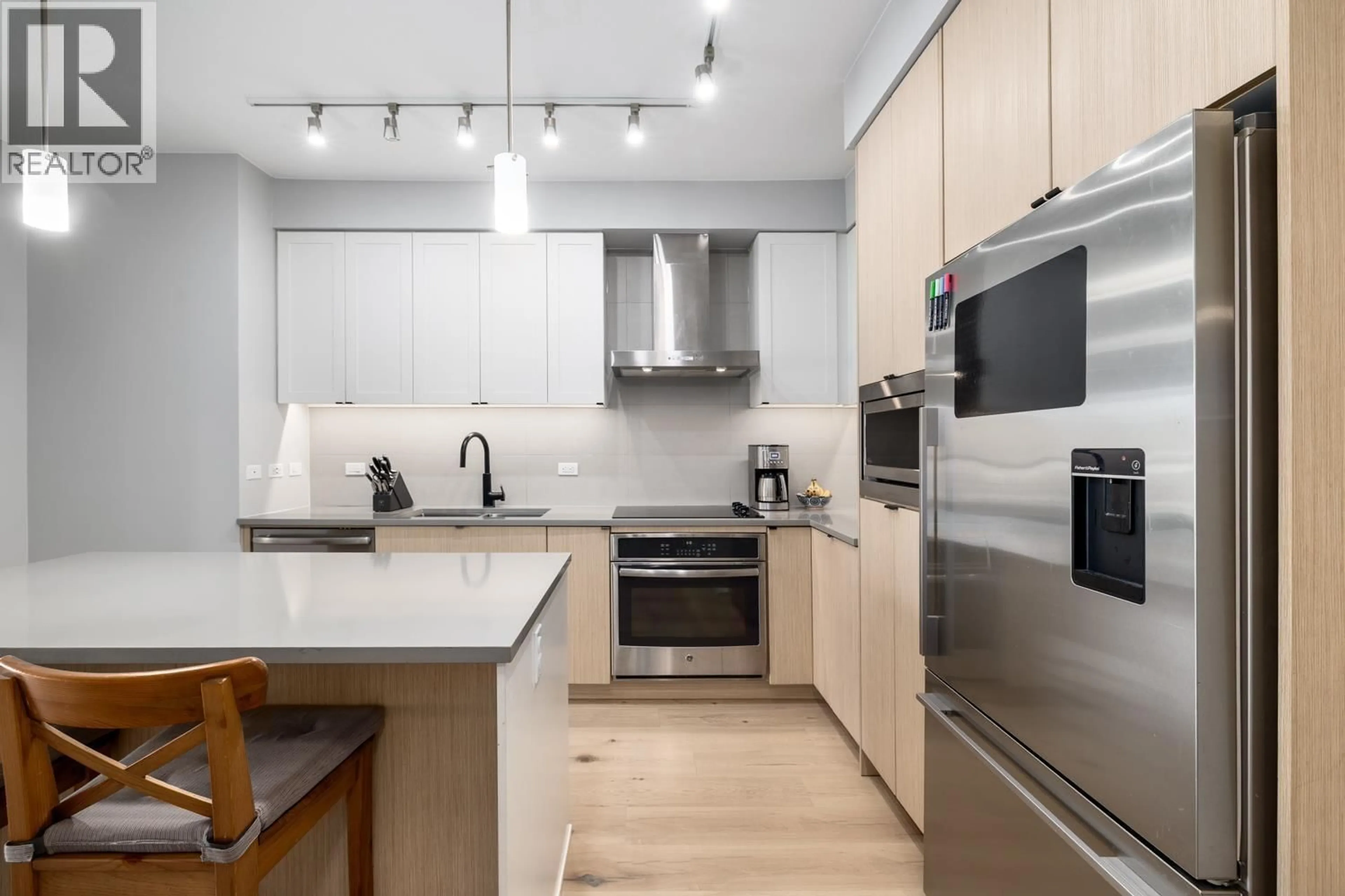 Contemporary kitchen, wood/laminate floor for 207 - 3205 MOUNTAIN HIGHWAY, North Vancouver British Columbia V7K0A3