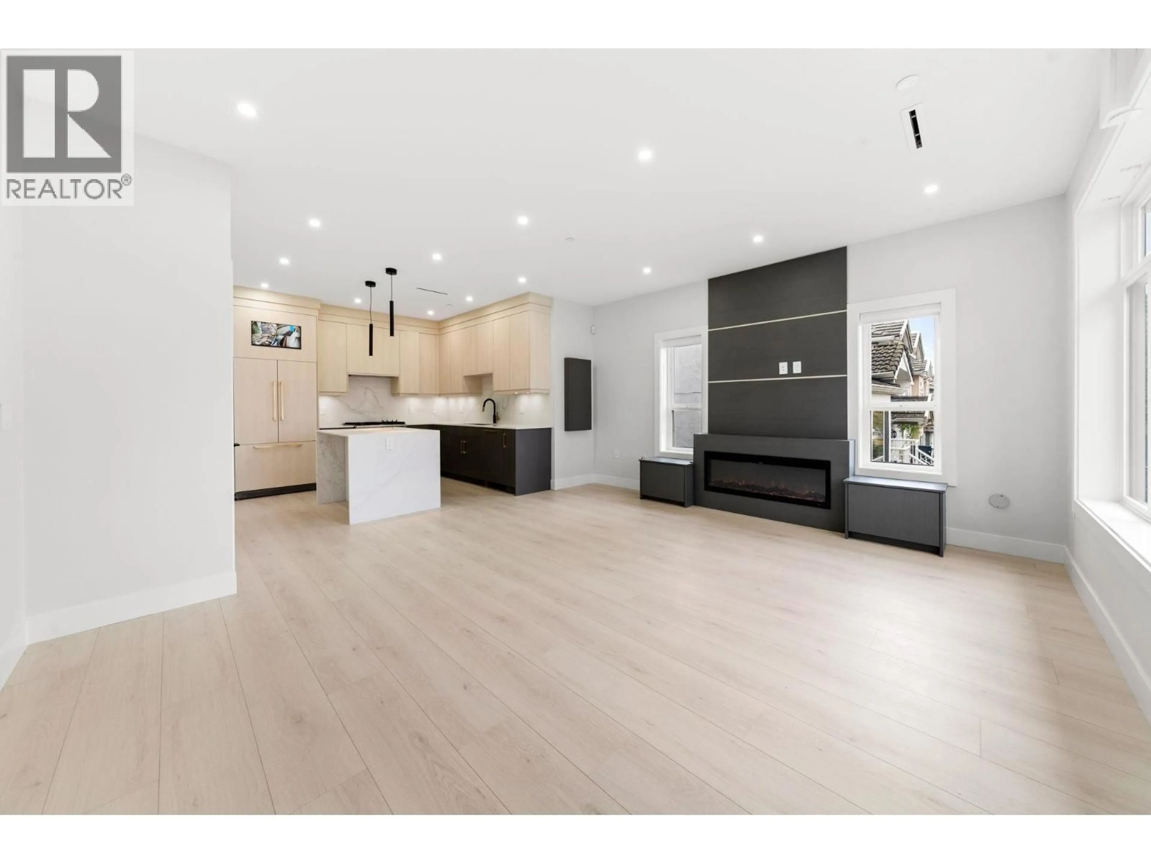 Open concept kitchen, wood/laminate floor for 1 - 3274 44TH AVENUE, Vancouver British Columbia V5R3B1