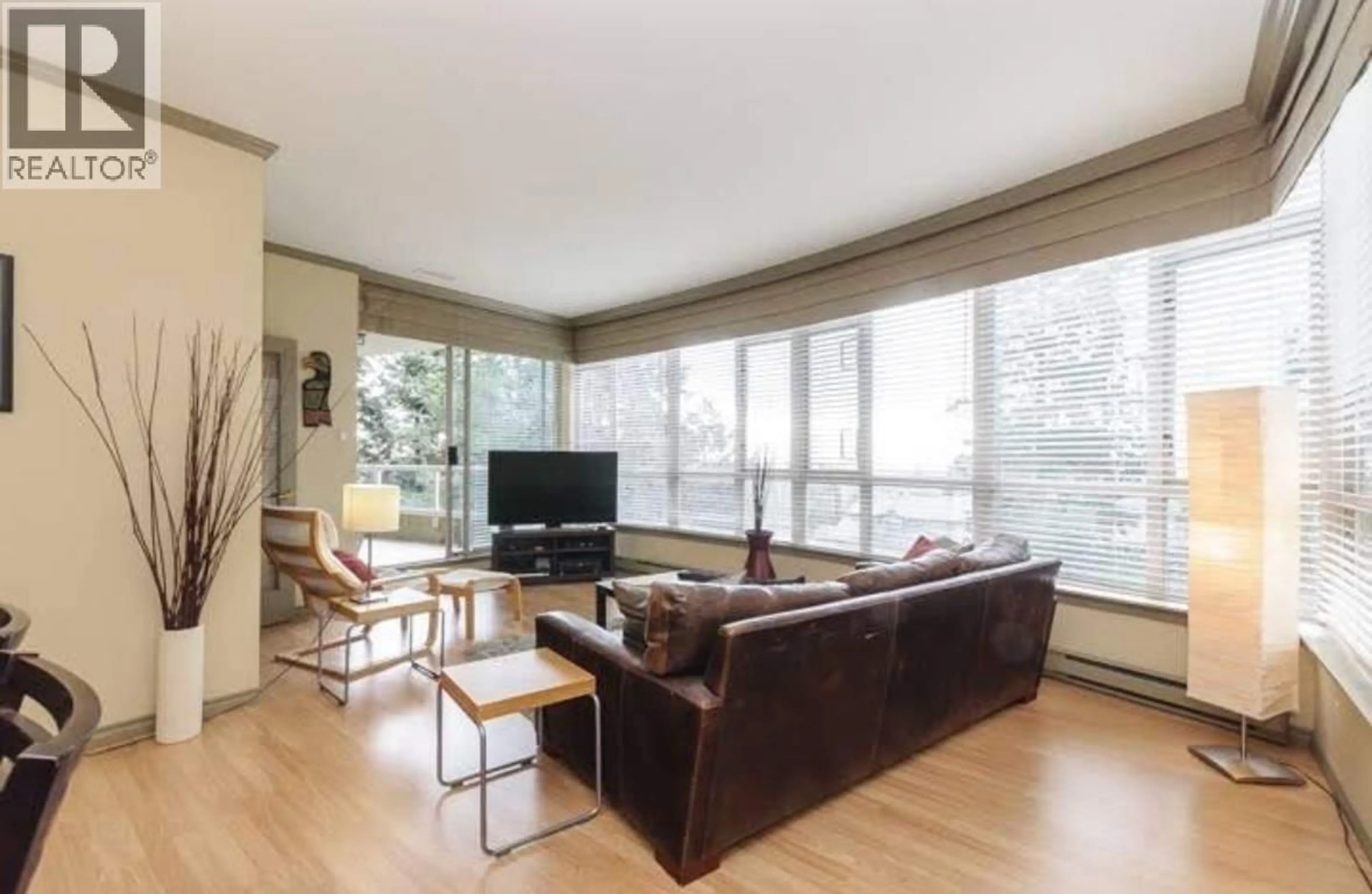 Living room with furniture, wood/laminate floor for 402 - 6888 STATION HILL DRIVE, Burnaby British Columbia V3N4X5