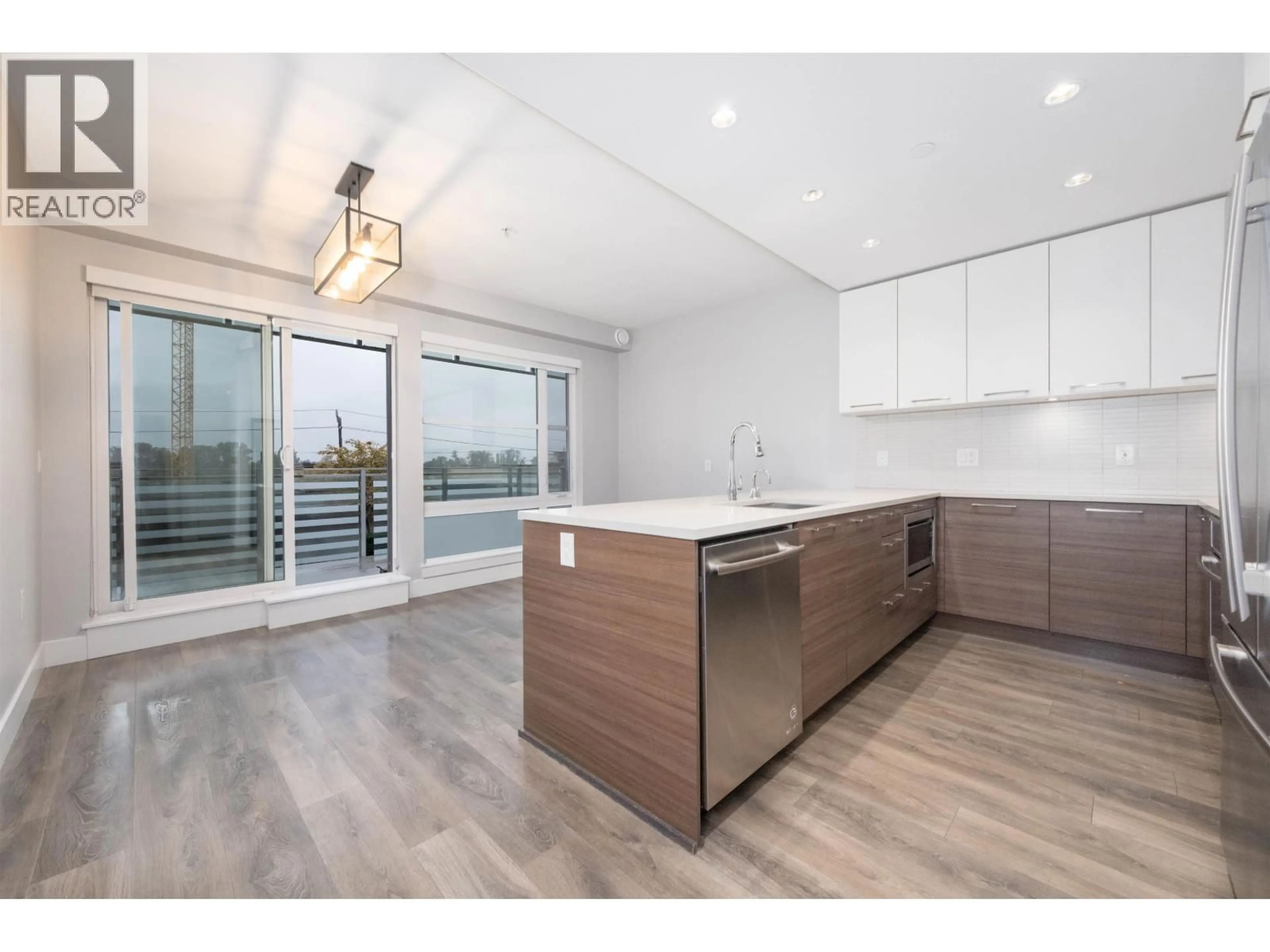 Open concept kitchen, unknown for 501 - 3488 SAWMILL CRESCENT, Vancouver British Columbia V5S0C7