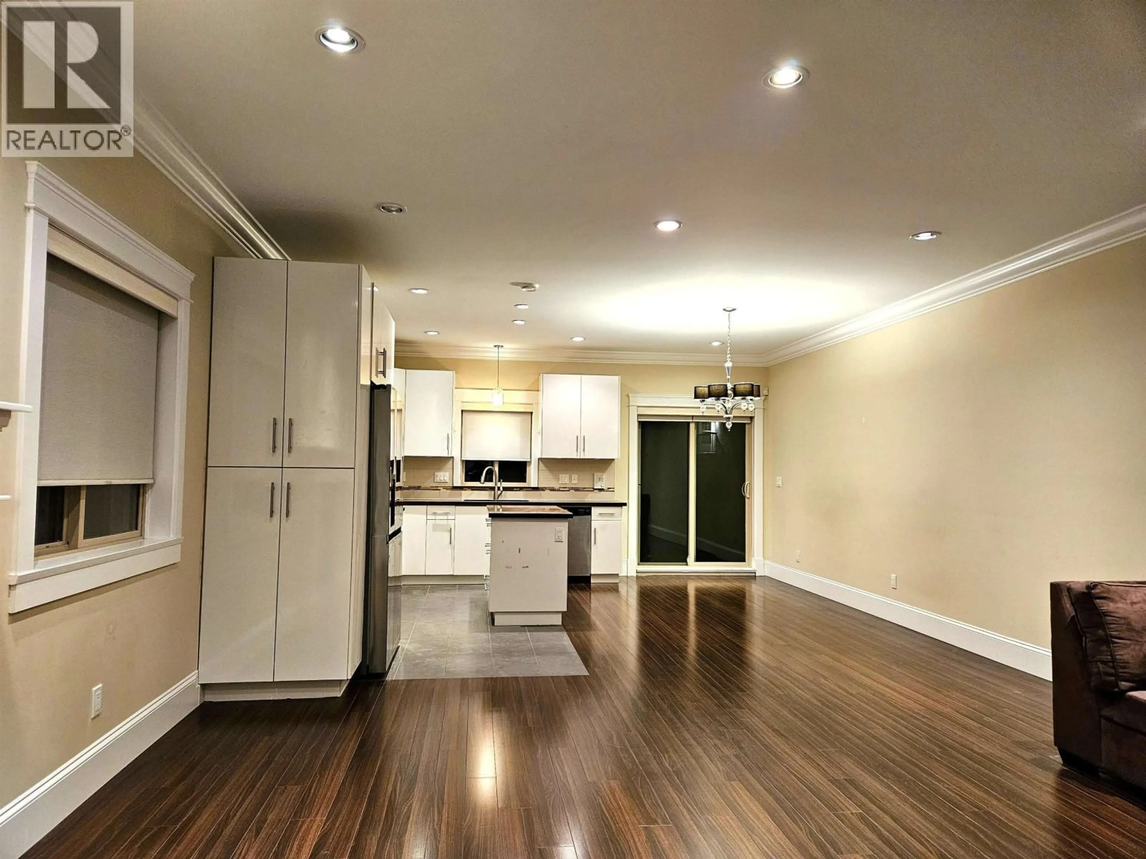 Open concept kitchen, wood/laminate floor for 6973 DUNBLANE AVENUE, Burnaby British Columbia V5J4G1