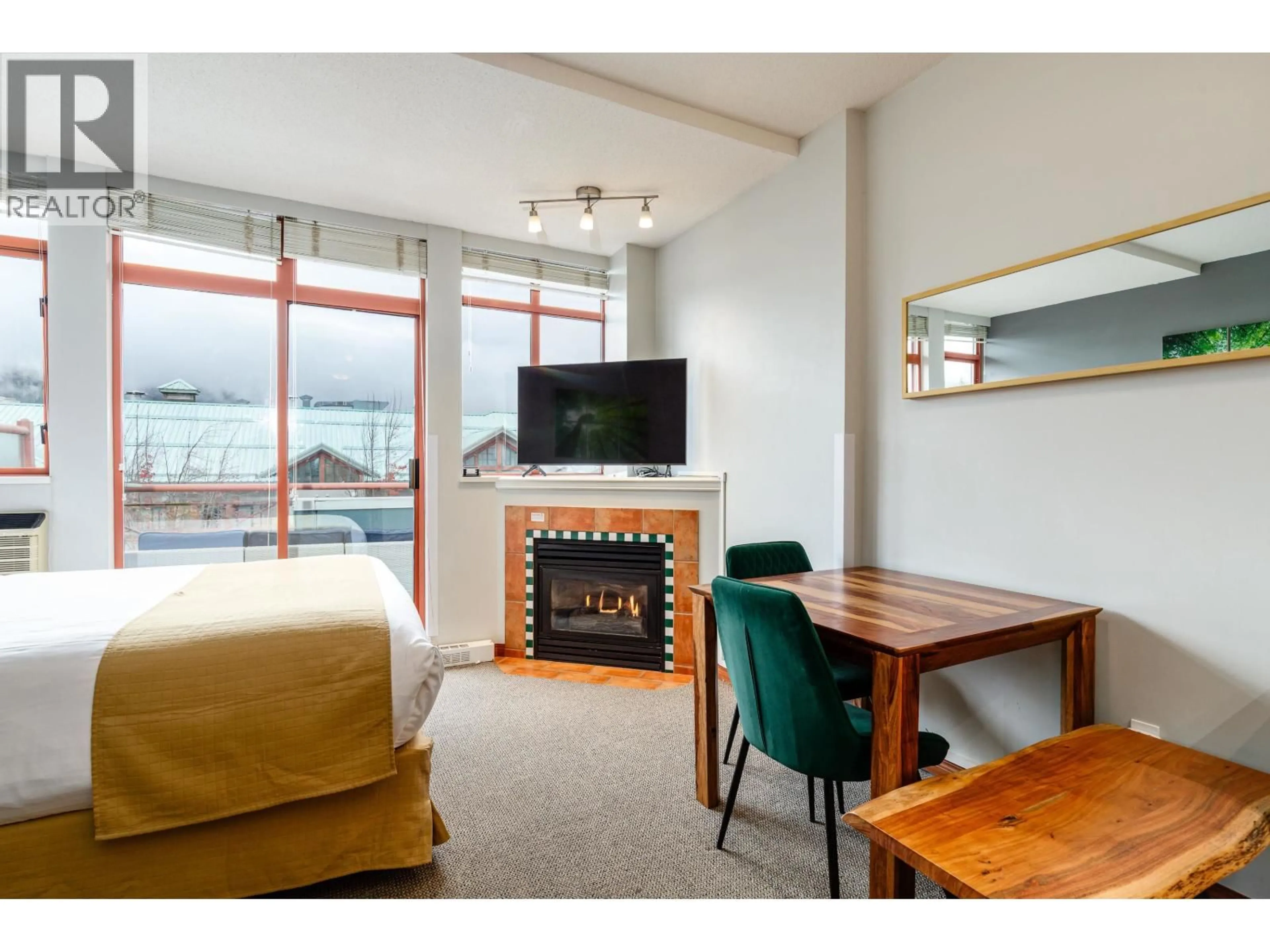 Living room with furniture, wood/laminate floor for 419 - 4369 MAIN STREET, Whistler British Columbia V8E1B7