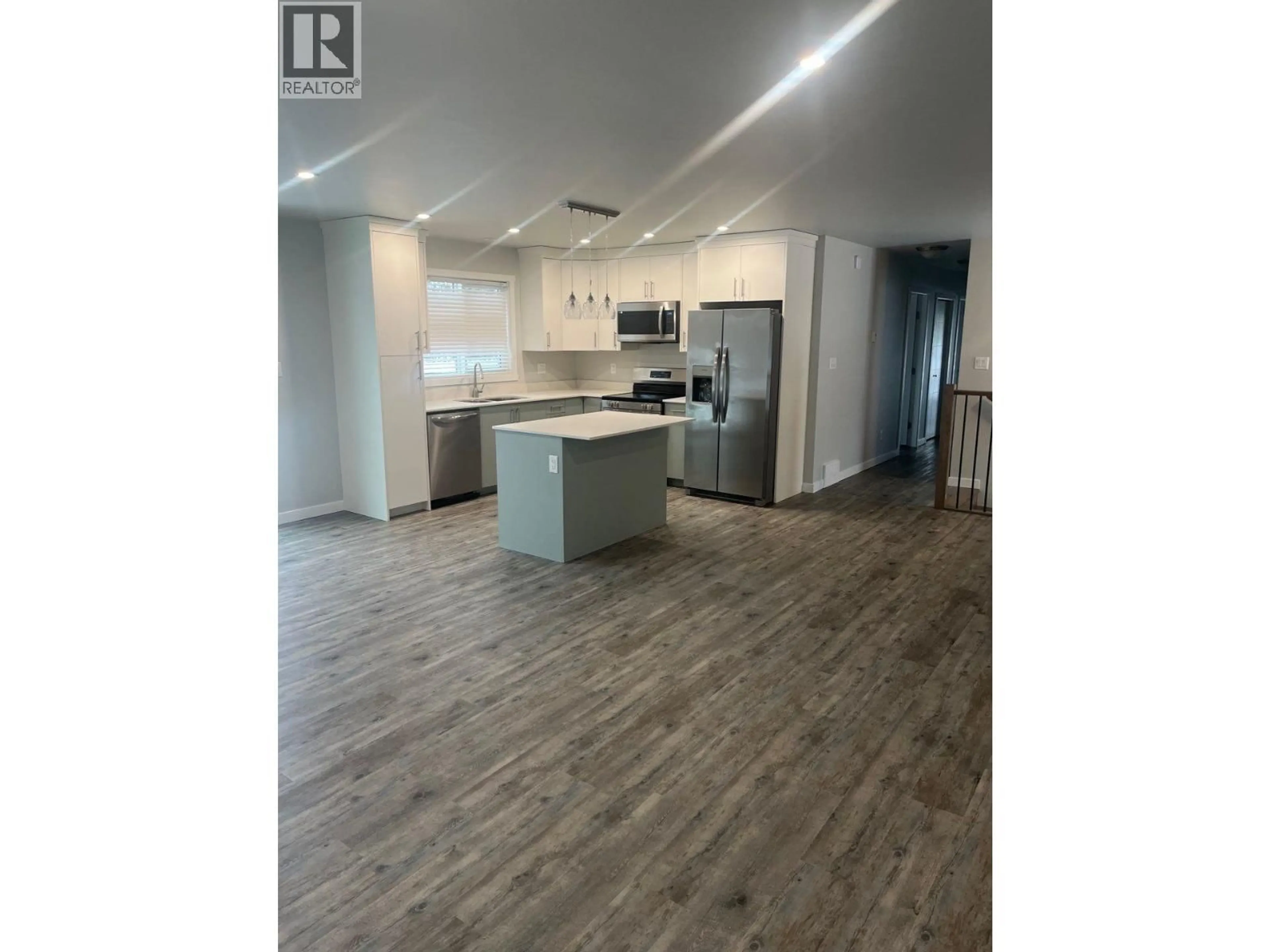 Open concept kitchen, wood/laminate floor for 1221 BLACKBURN ROAD, Prince George British Columbia V2N6B7