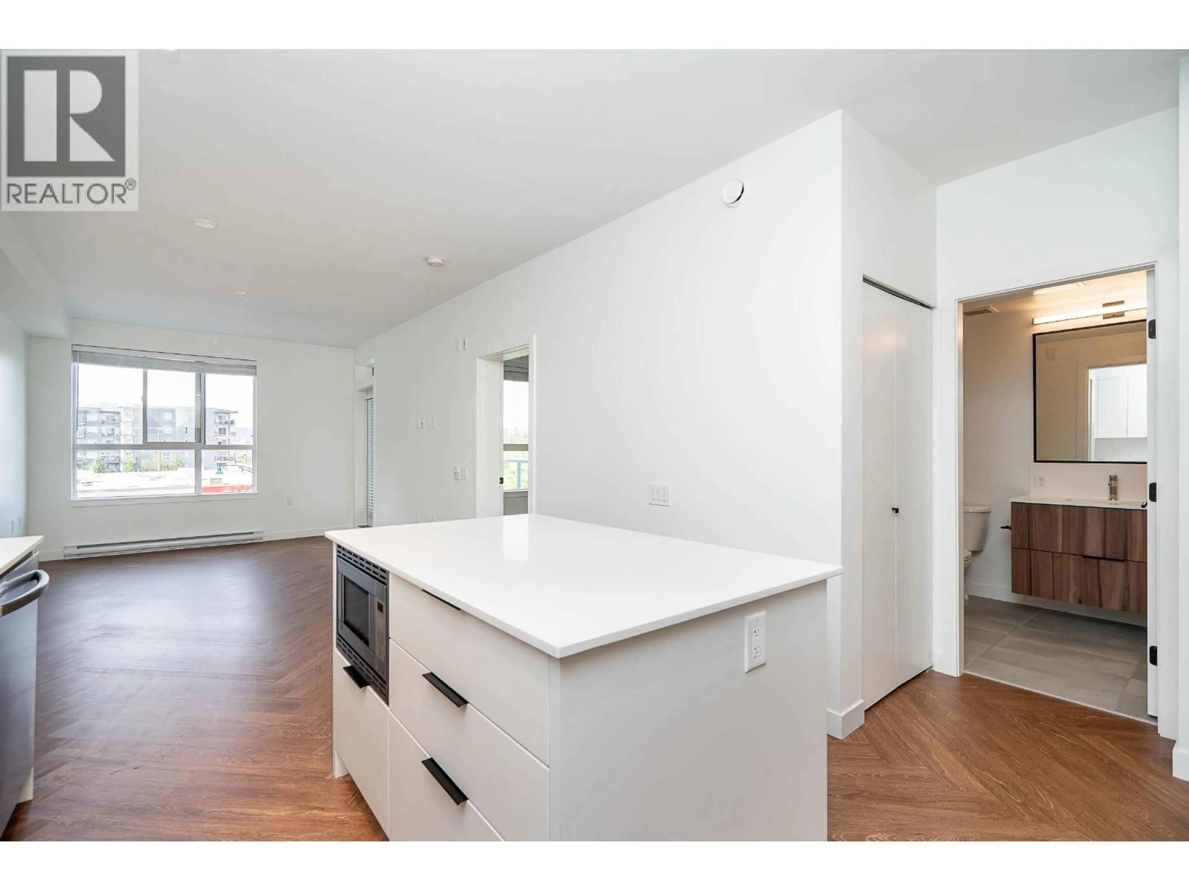 Open concept kitchen, wood/laminate floor for 307 - 3229 ST JOHNS STREET, Port Moody British Columbia V3H0M4