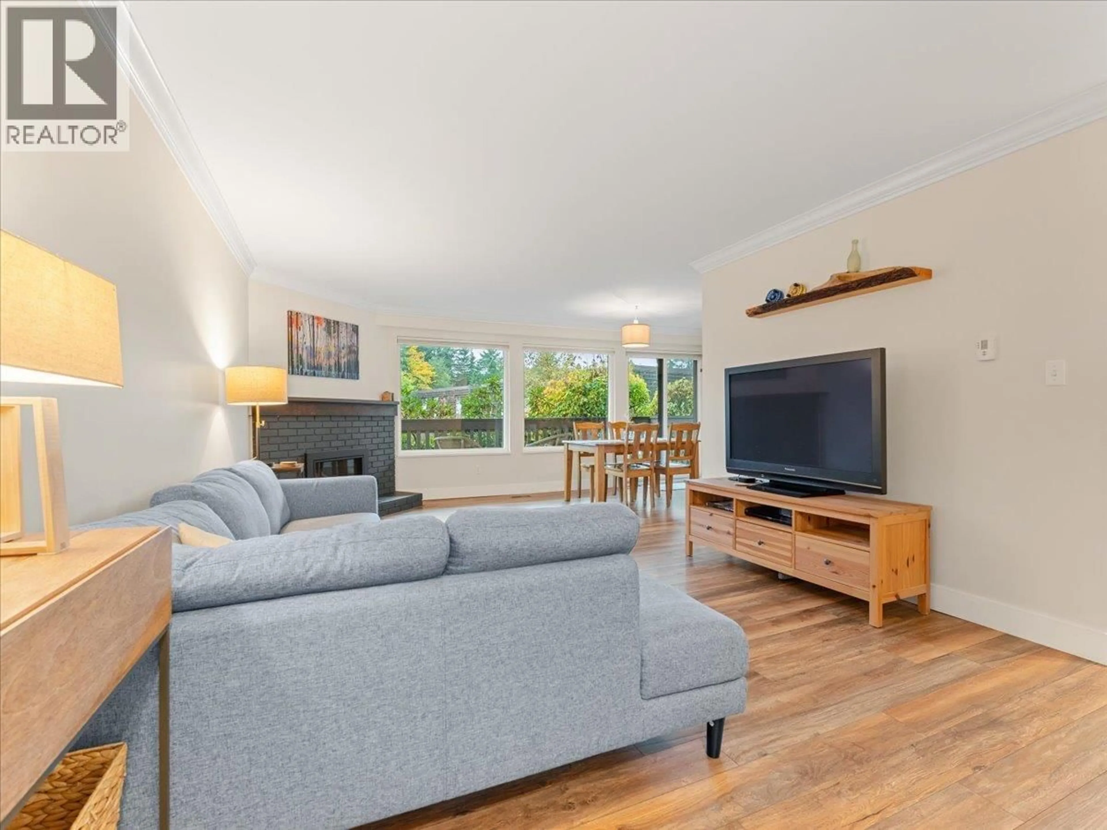 Living room with furniture, wood/laminate floor for 1019 OLD LILLOOET ROAD, North Vancouver British Columbia V7J3H6