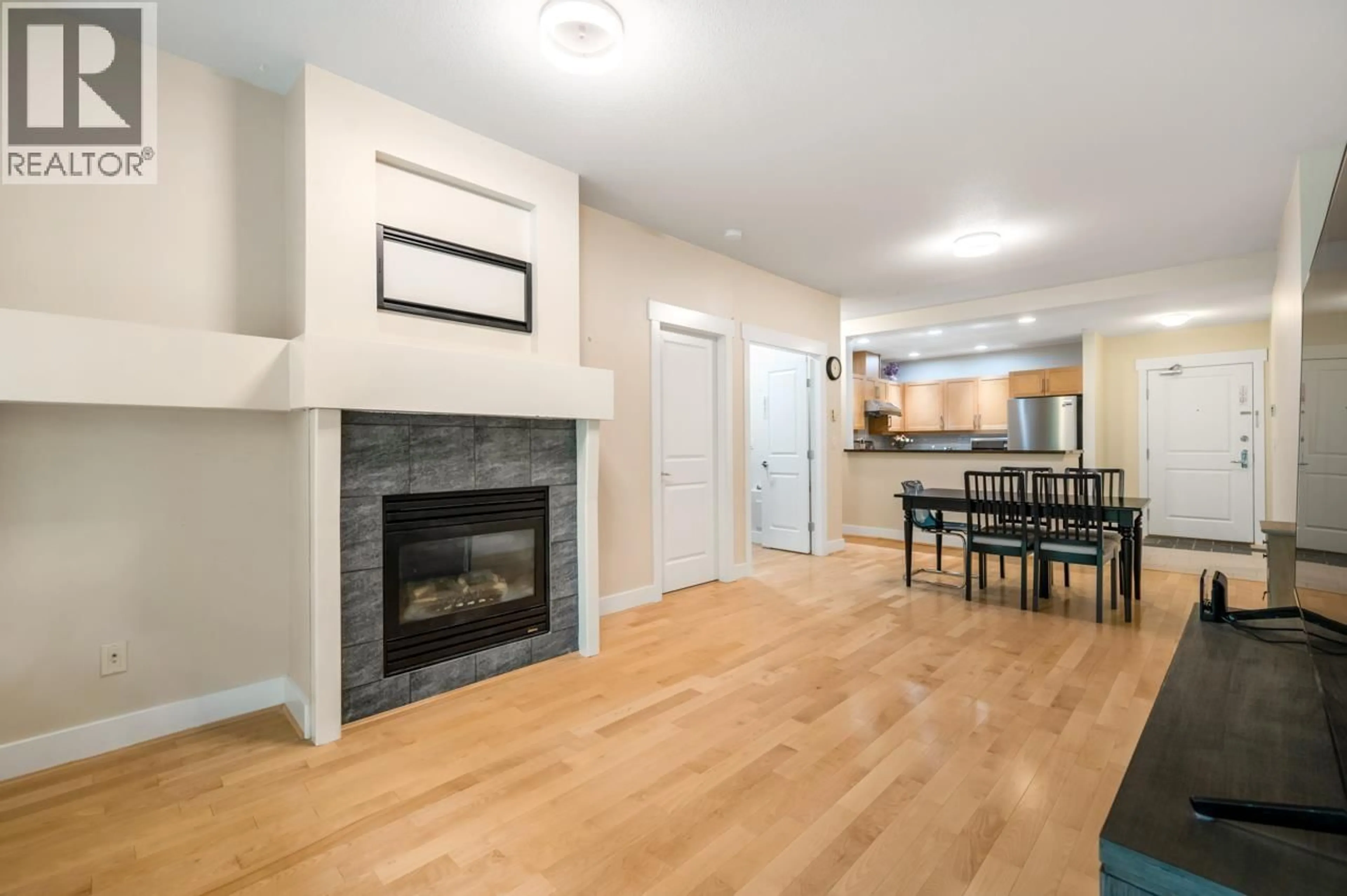 Living room with furniture, wood/laminate floor for 312 - 6328 LARKIN DRIVE, Vancouver British Columbia V6T2K2