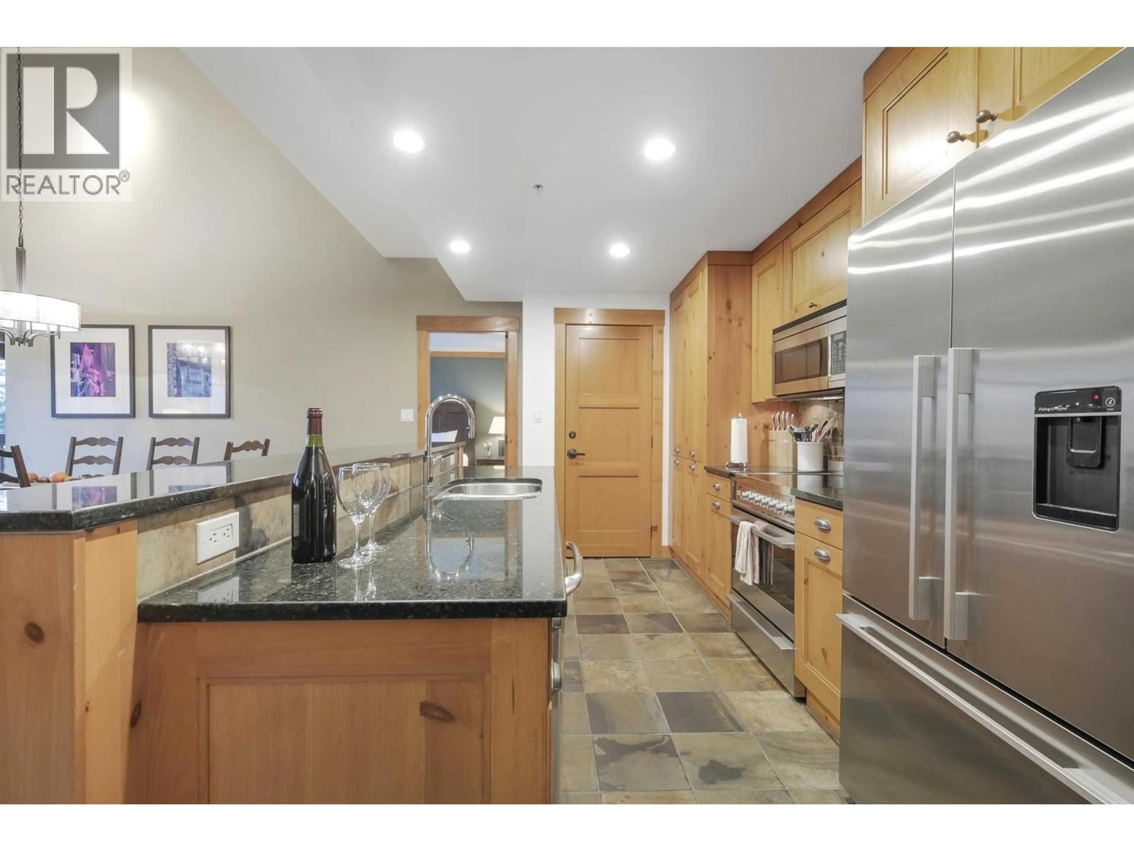 Open concept kitchen, ceramic/tile floor for 401 - 2202 GONDOLA WAY, Whistler British Columbia V8E0M7