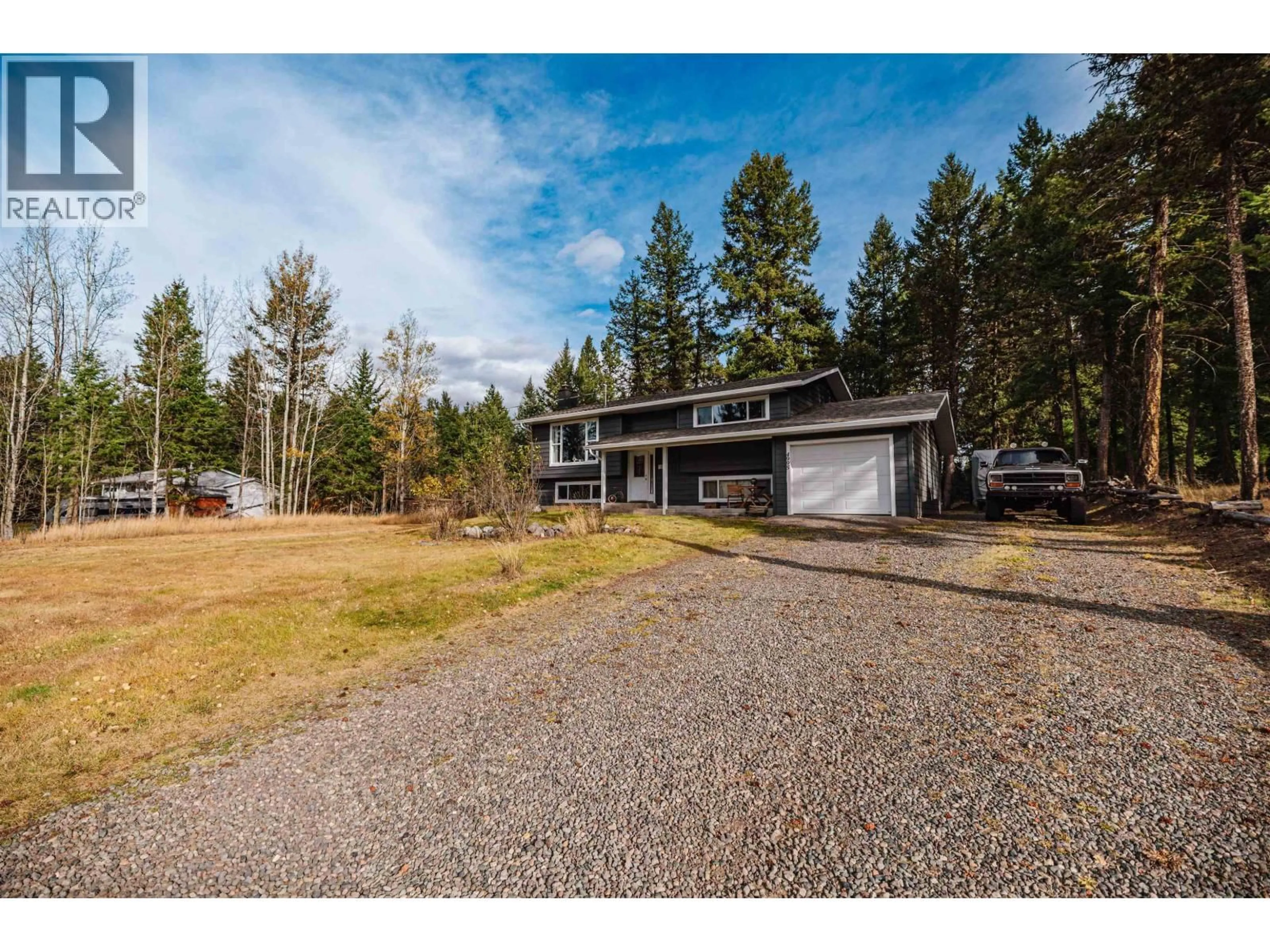 A pic from outside/outdoor area/front of a property/back of a property/a pic from drone, unknown for 4995 SMITH ROAD, 108 Mile Ranch British Columbia V0K2Z0