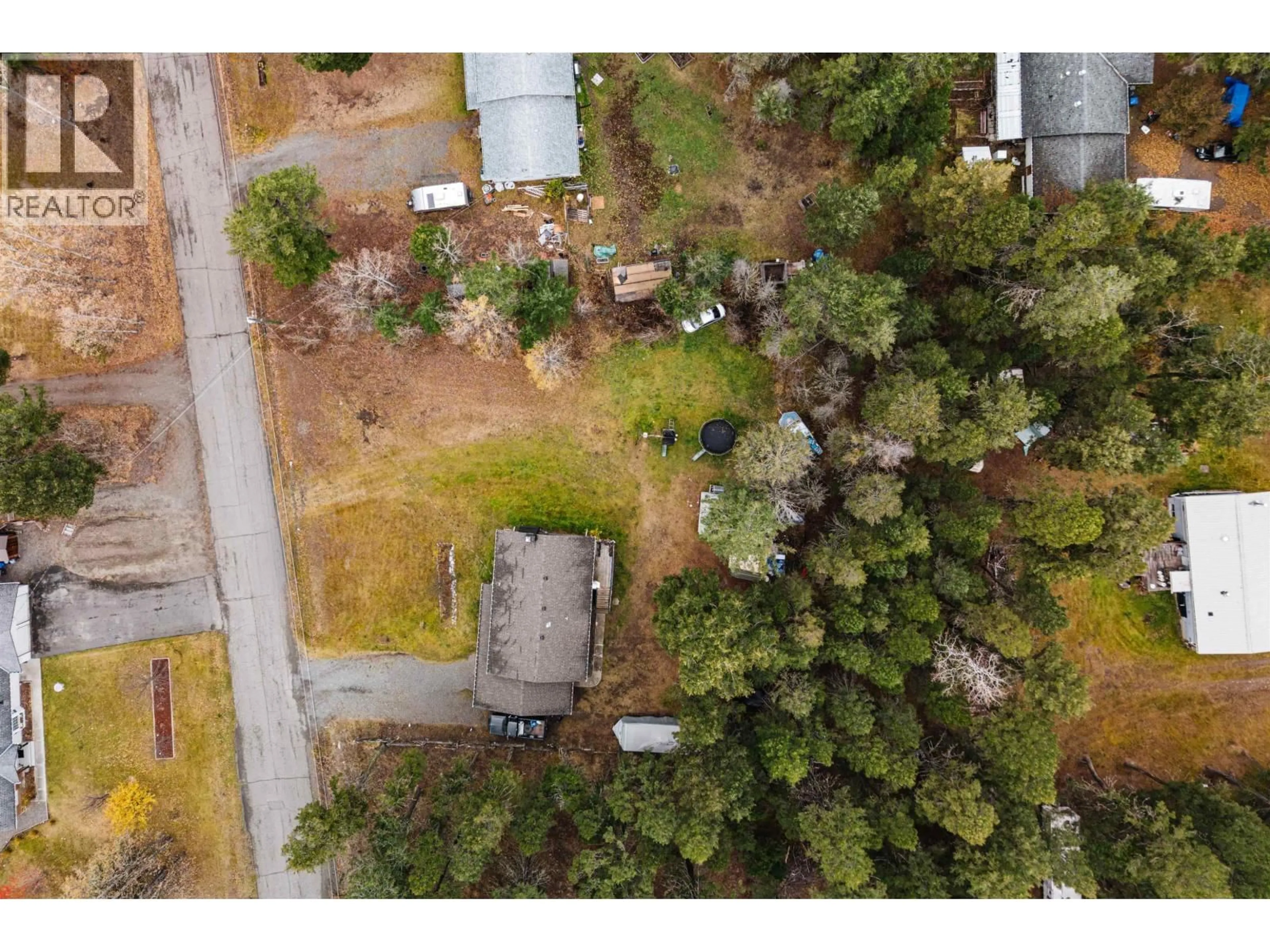 A pic from outside/outdoor area/front of a property/back of a property/a pic from drone, forest/trees view for 4995 SMITH ROAD, 108 Mile Ranch British Columbia V0K2Z0