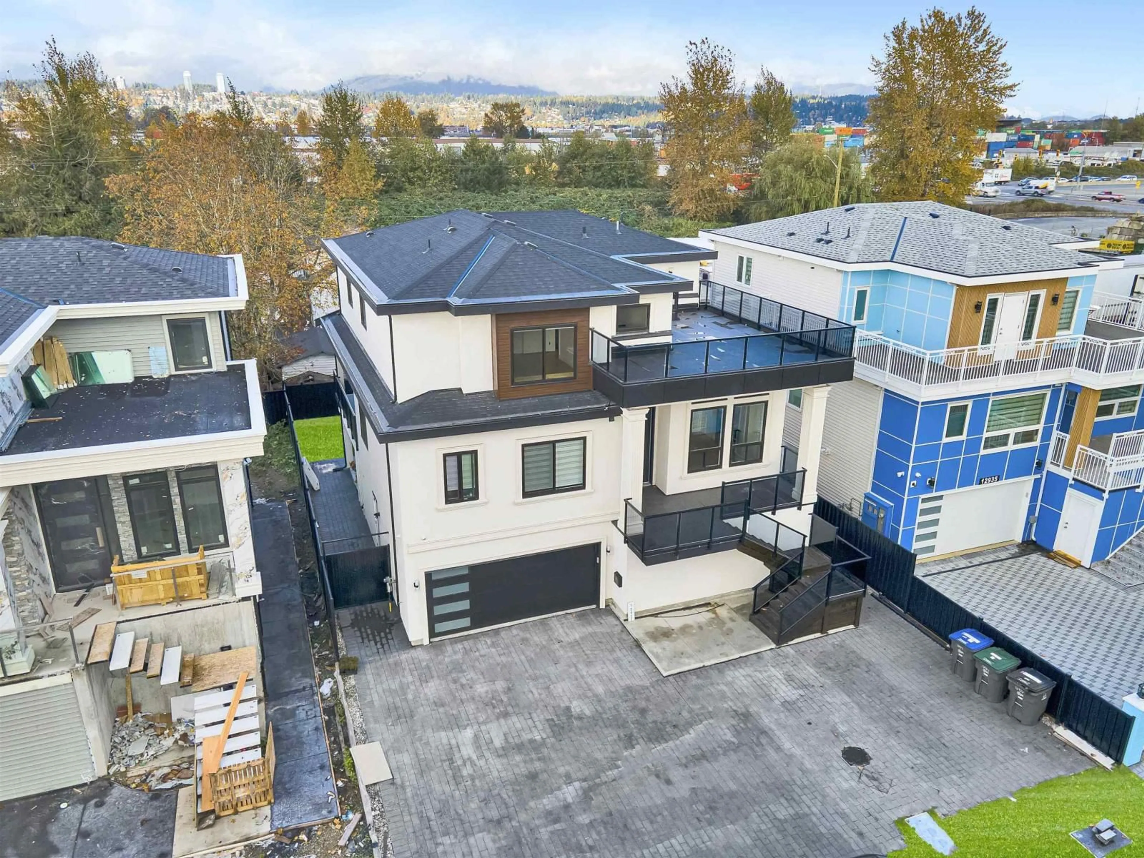 A pic from outside/outdoor area/front of a property/back of a property/a pic from drone, street for 12927 115A, Surrey British Columbia V3R2R3