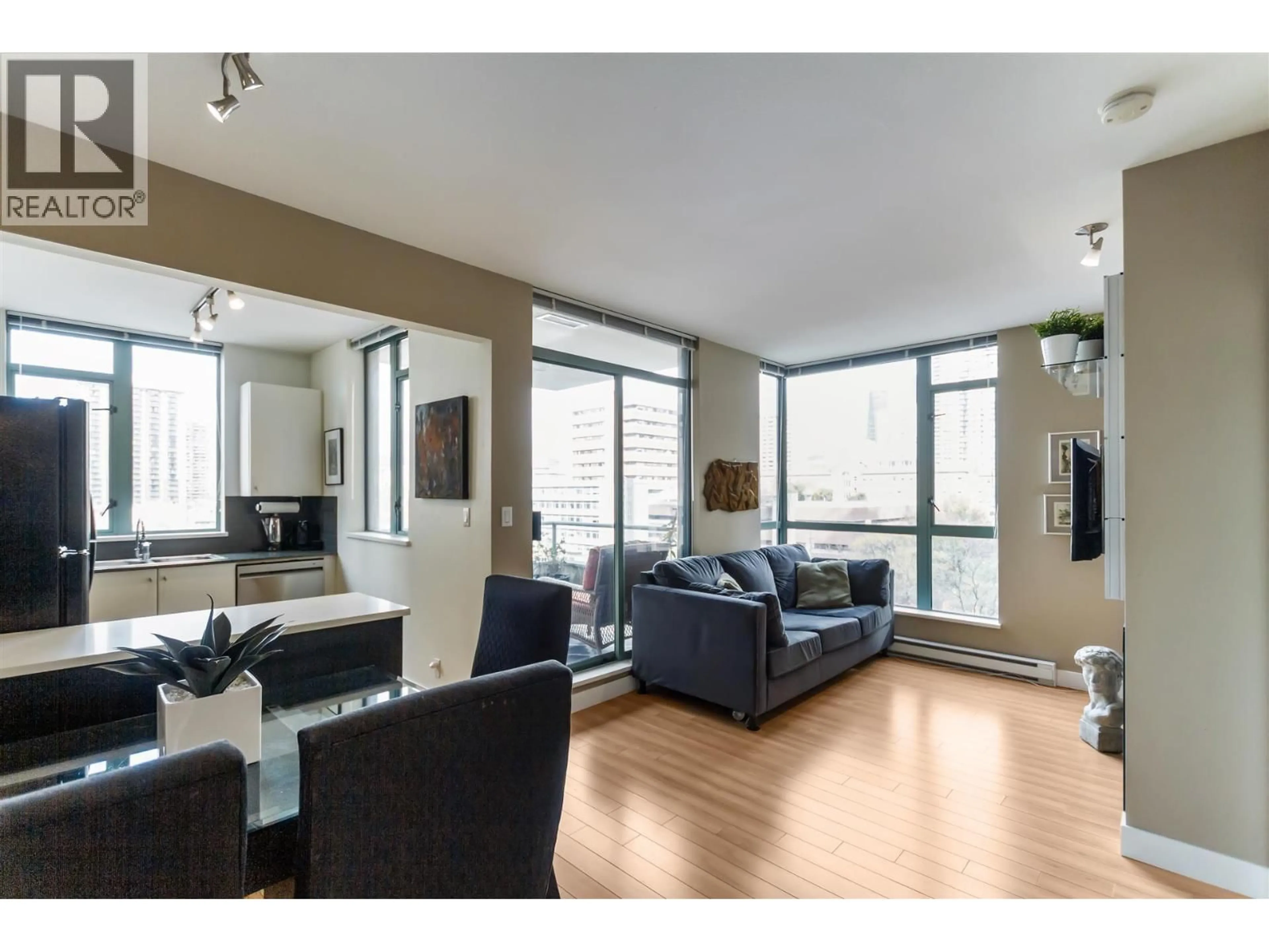 Living room with furniture, wood/laminate floor for 706 - 1238 BURRARD STREET, Vancouver British Columbia V6Z3E1