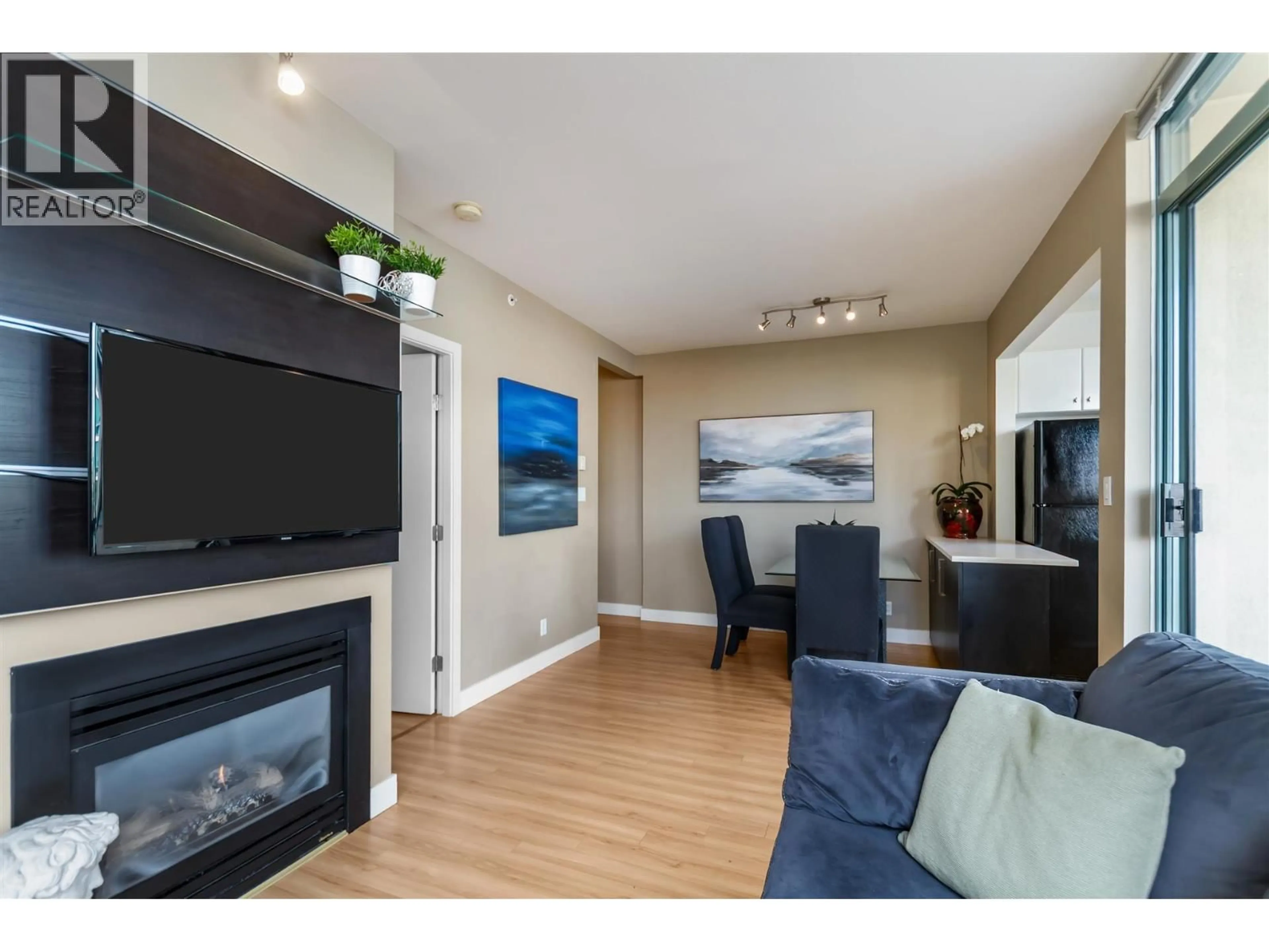 Living room with furniture, wood/laminate floor for 706 - 1238 BURRARD STREET, Vancouver British Columbia V6Z3E1