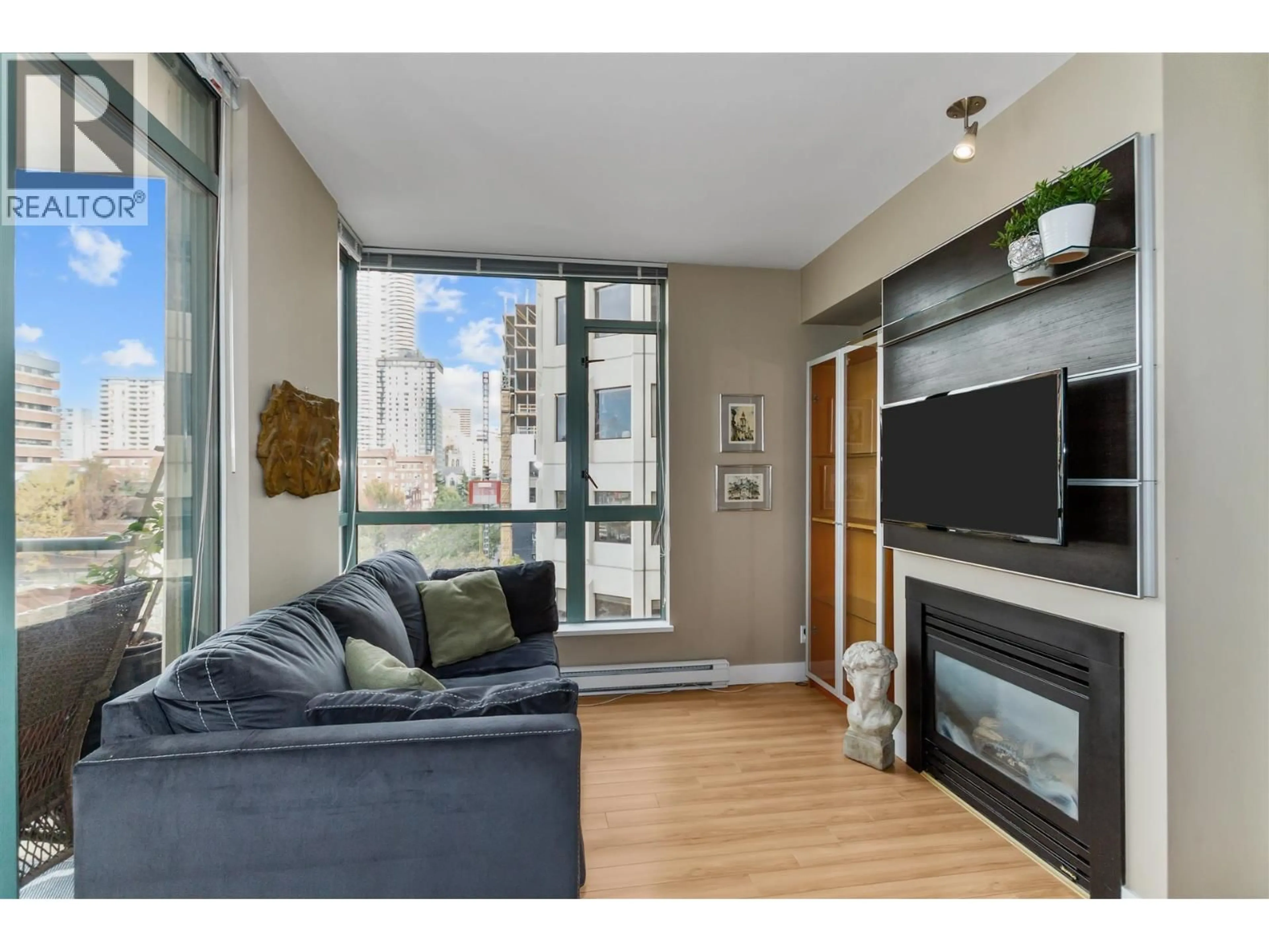 Living room with furniture, wood/laminate floor for 706 - 1238 BURRARD STREET, Vancouver British Columbia V6Z3E1