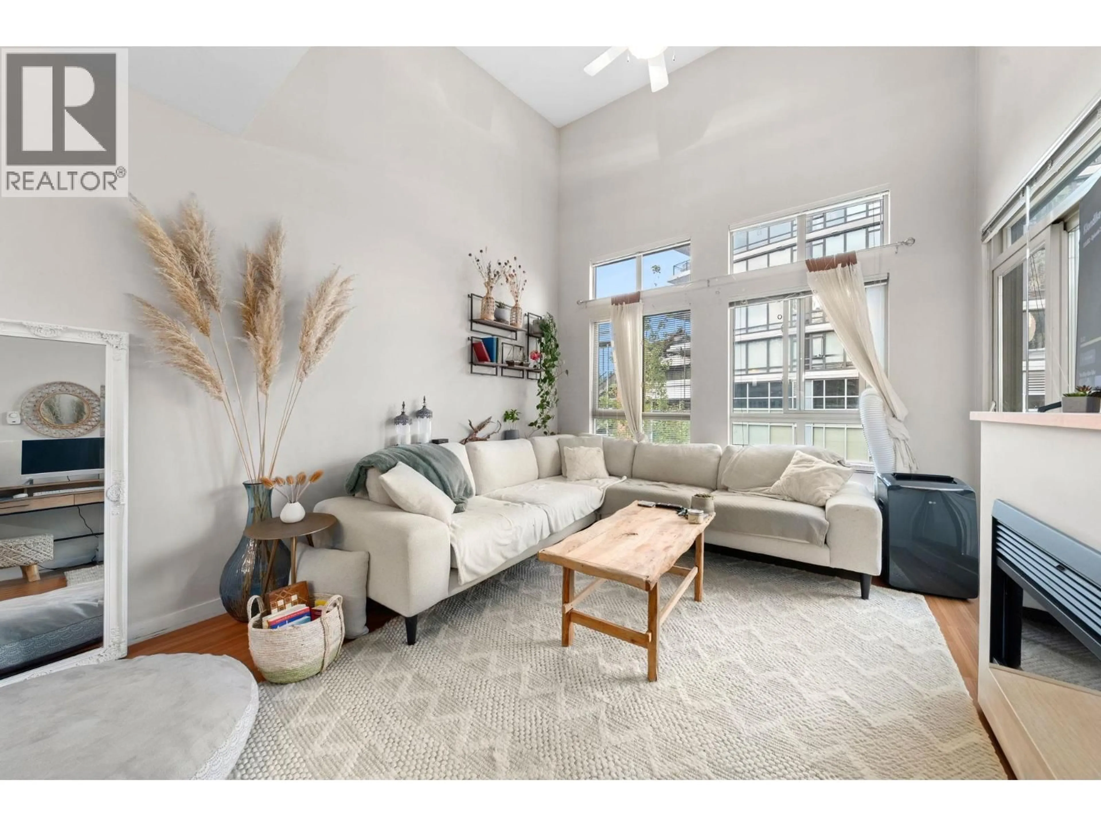 Living room with furniture, unknown for 411 - 201 MORRISSEY ROAD, Port Moody British Columbia V3H0E5