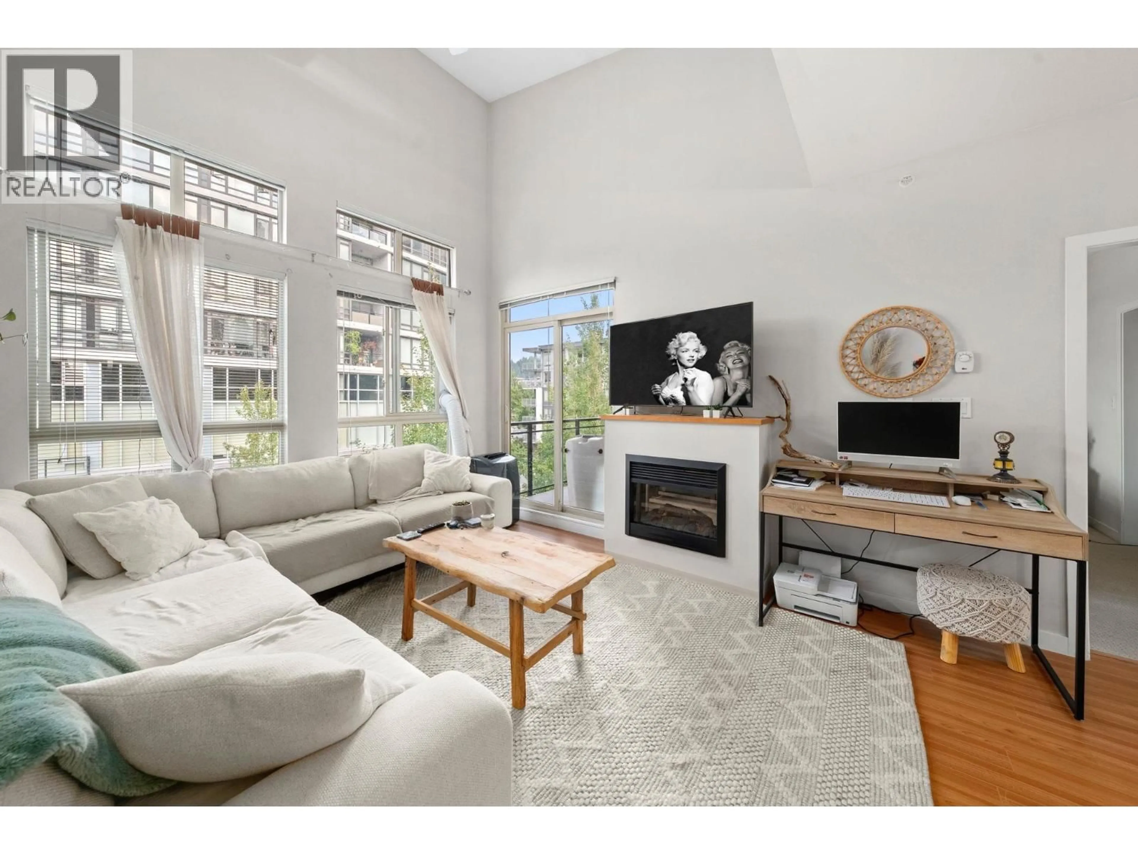 Living room with furniture, unknown for 411 - 201 MORRISSEY ROAD, Port Moody British Columbia V3H0E5