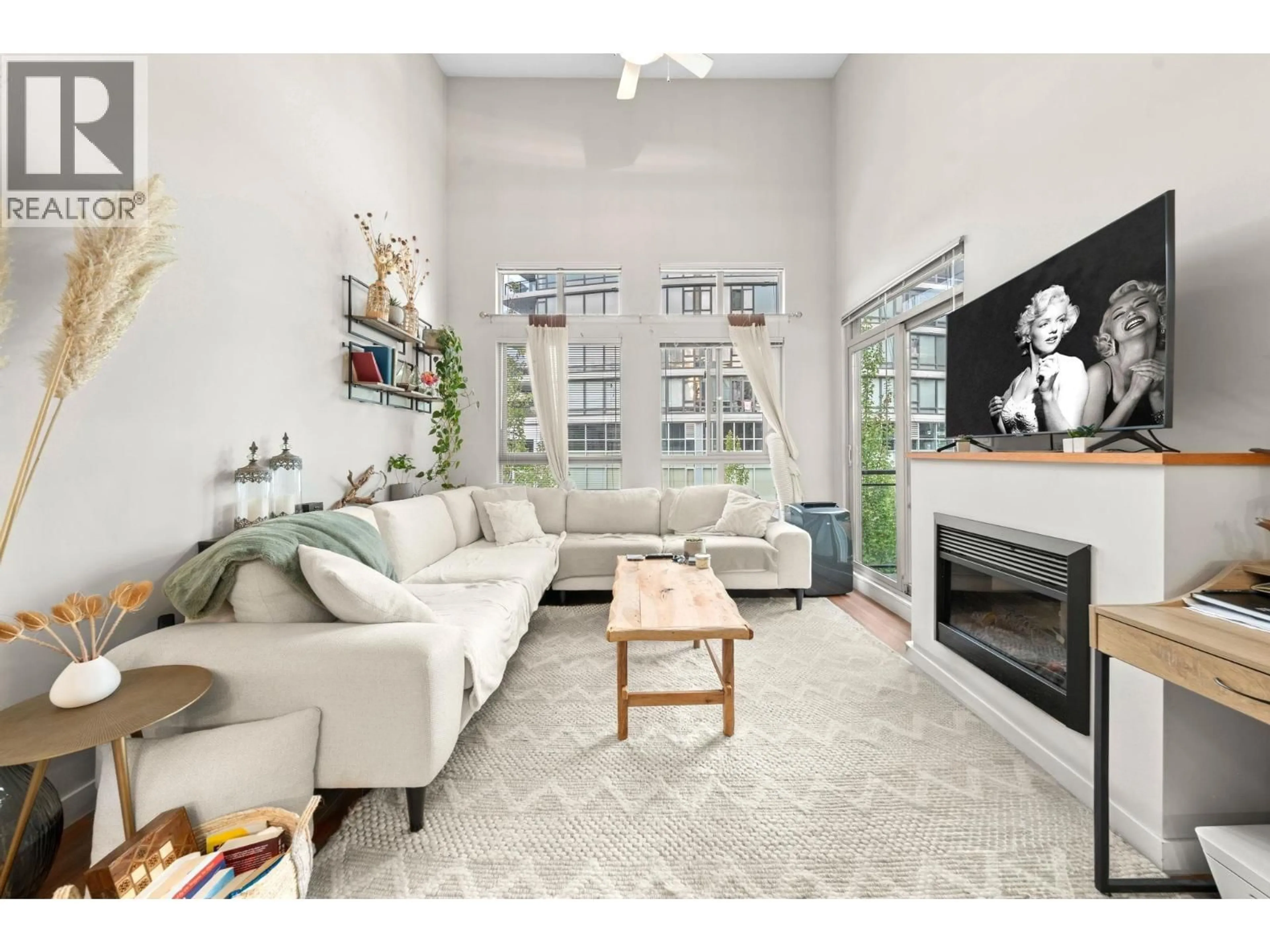 Living room with furniture, unknown for 411 - 201 MORRISSEY ROAD, Port Moody British Columbia V3H0E5