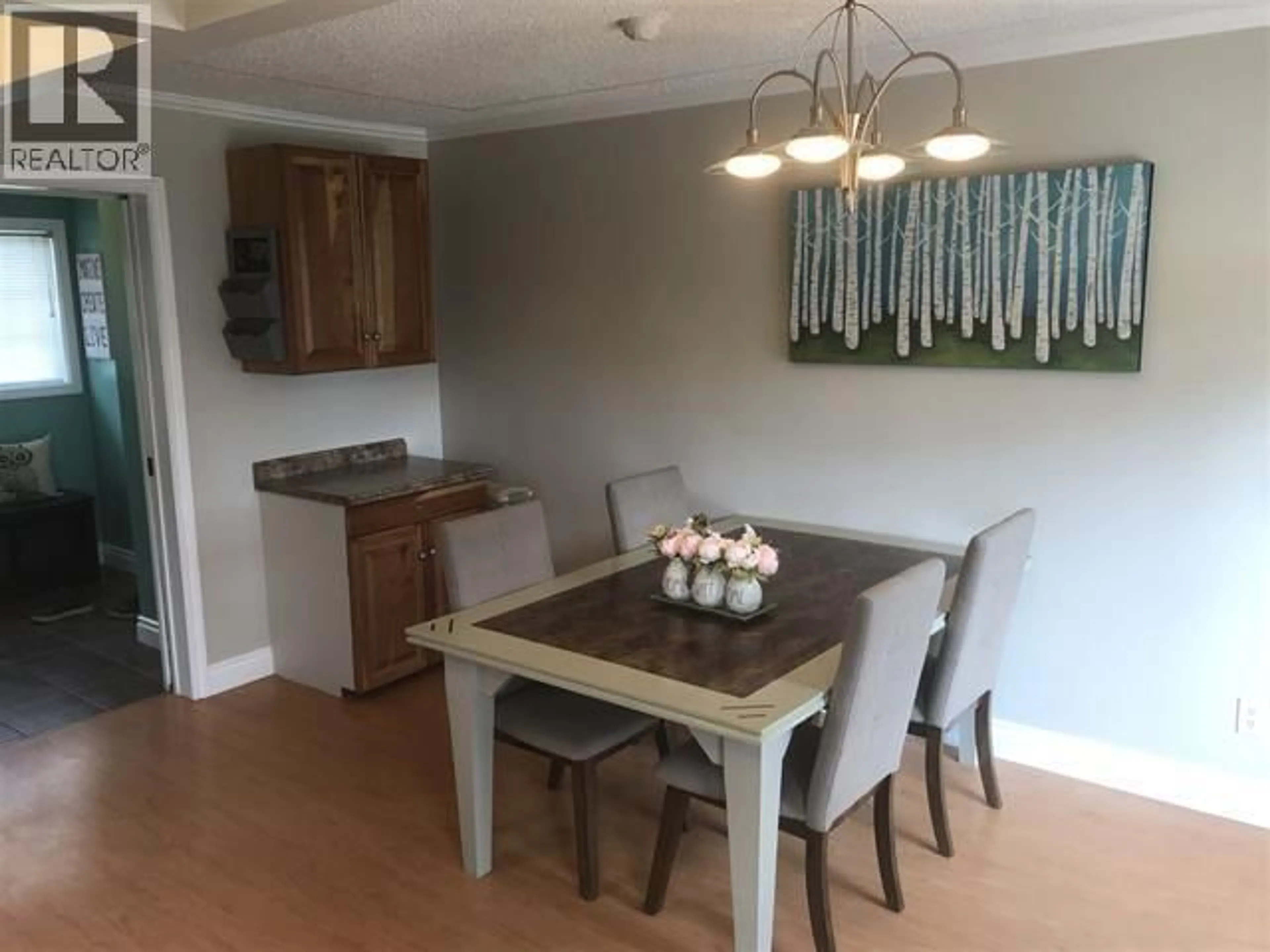 Dining room, wood/laminate floor for 9215 104 AVENUE, Fort St. John British Columbia V1J2J6