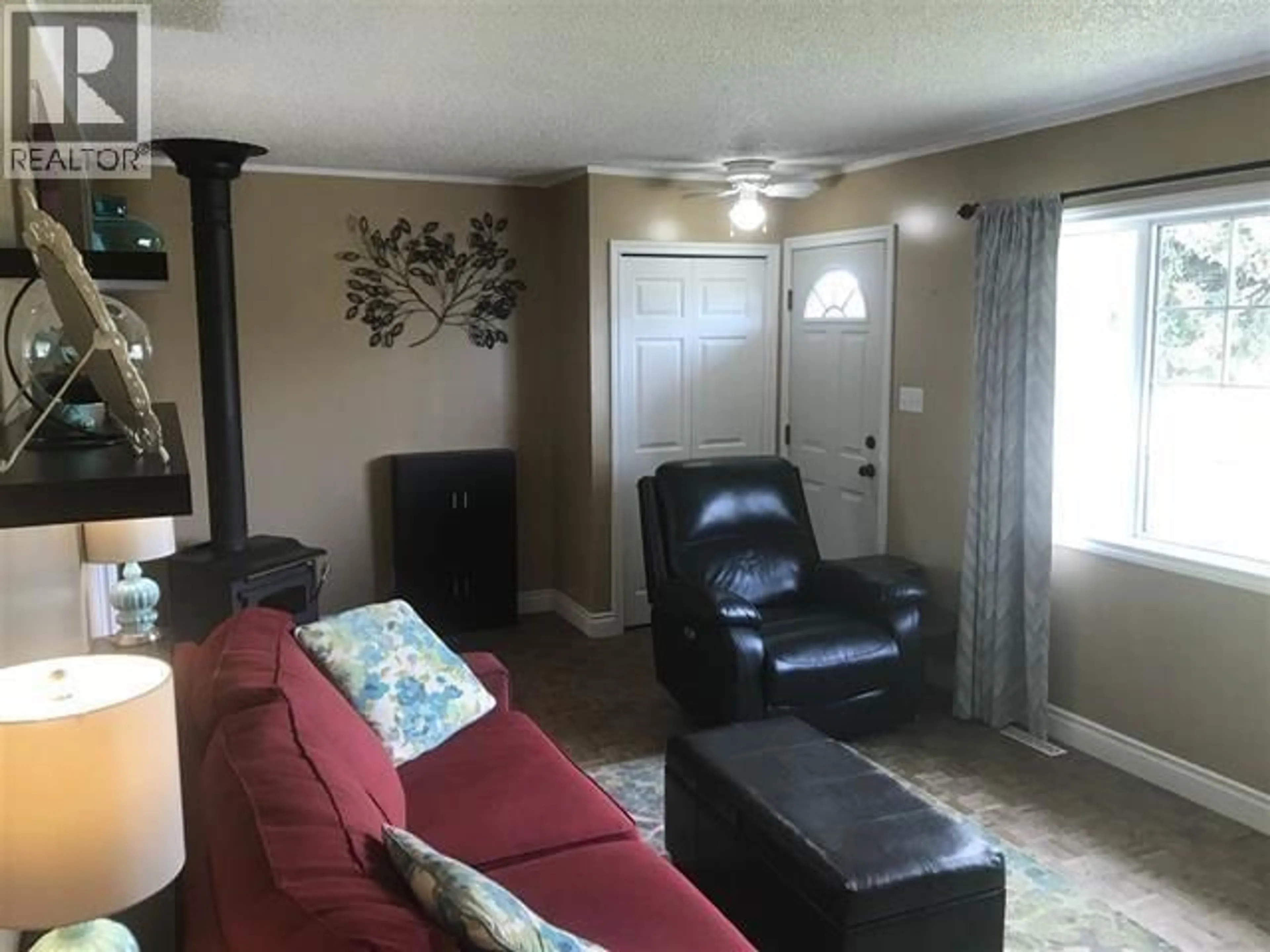 Living room with furniture, unknown for 9215 104 AVENUE, Fort St. John British Columbia V1J2J6