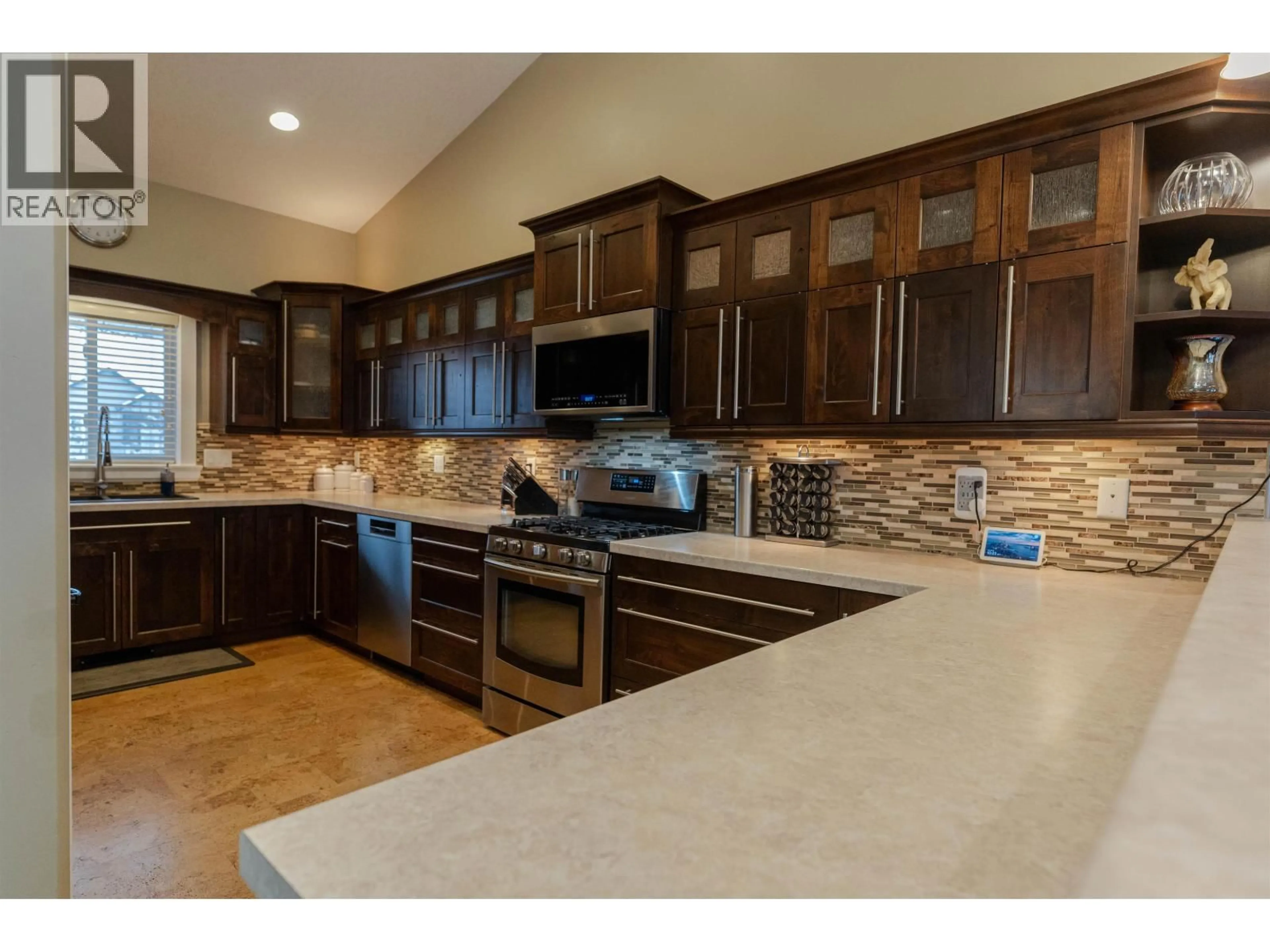 Open concept kitchen, ceramic/tile floor for 8707 112 AVENUE, Fort St. John British Columbia V1J0H9