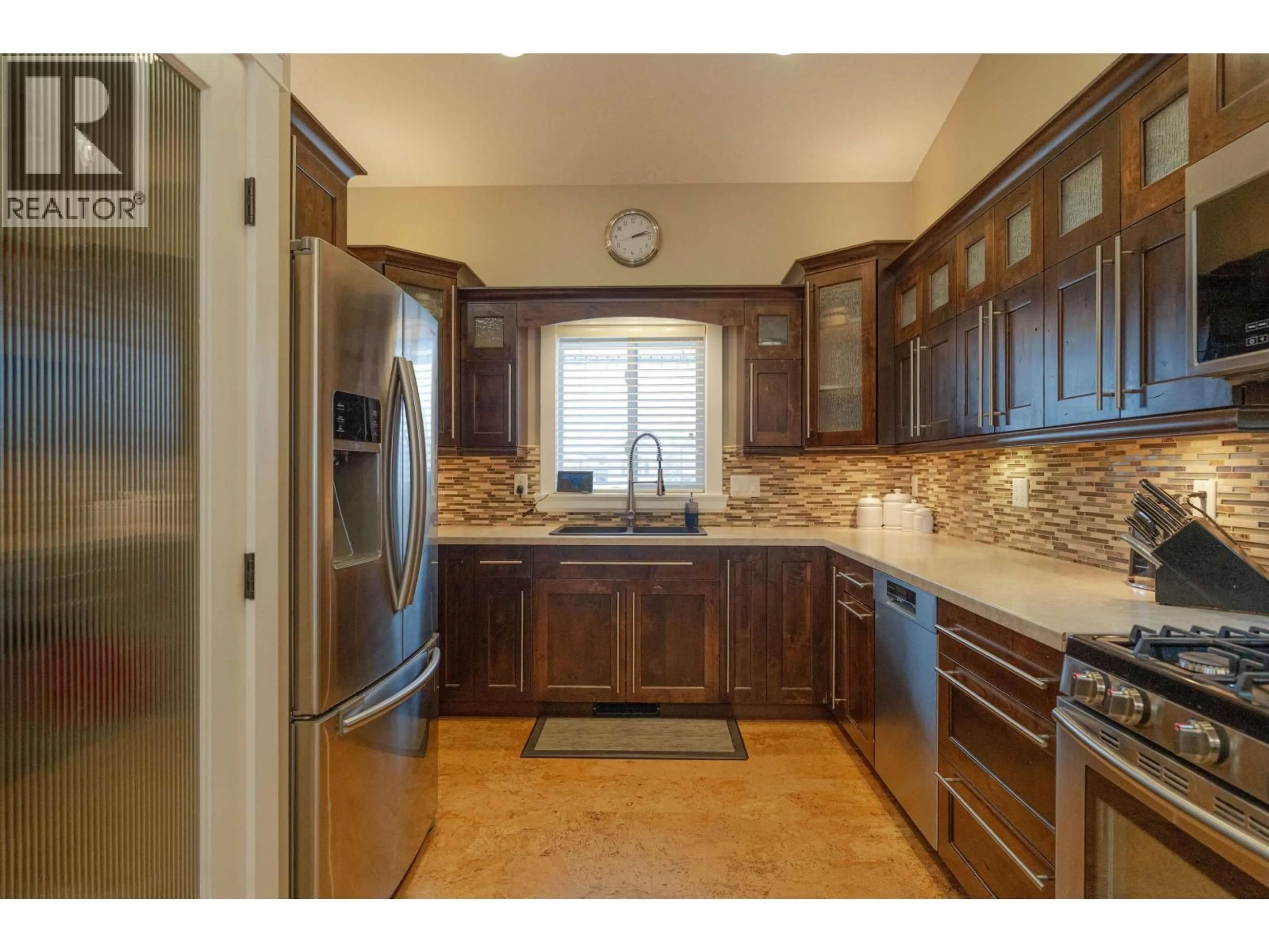 Open concept kitchen, ceramic/tile floor for 8707 112 AVENUE, Fort St. John British Columbia V1J0H9