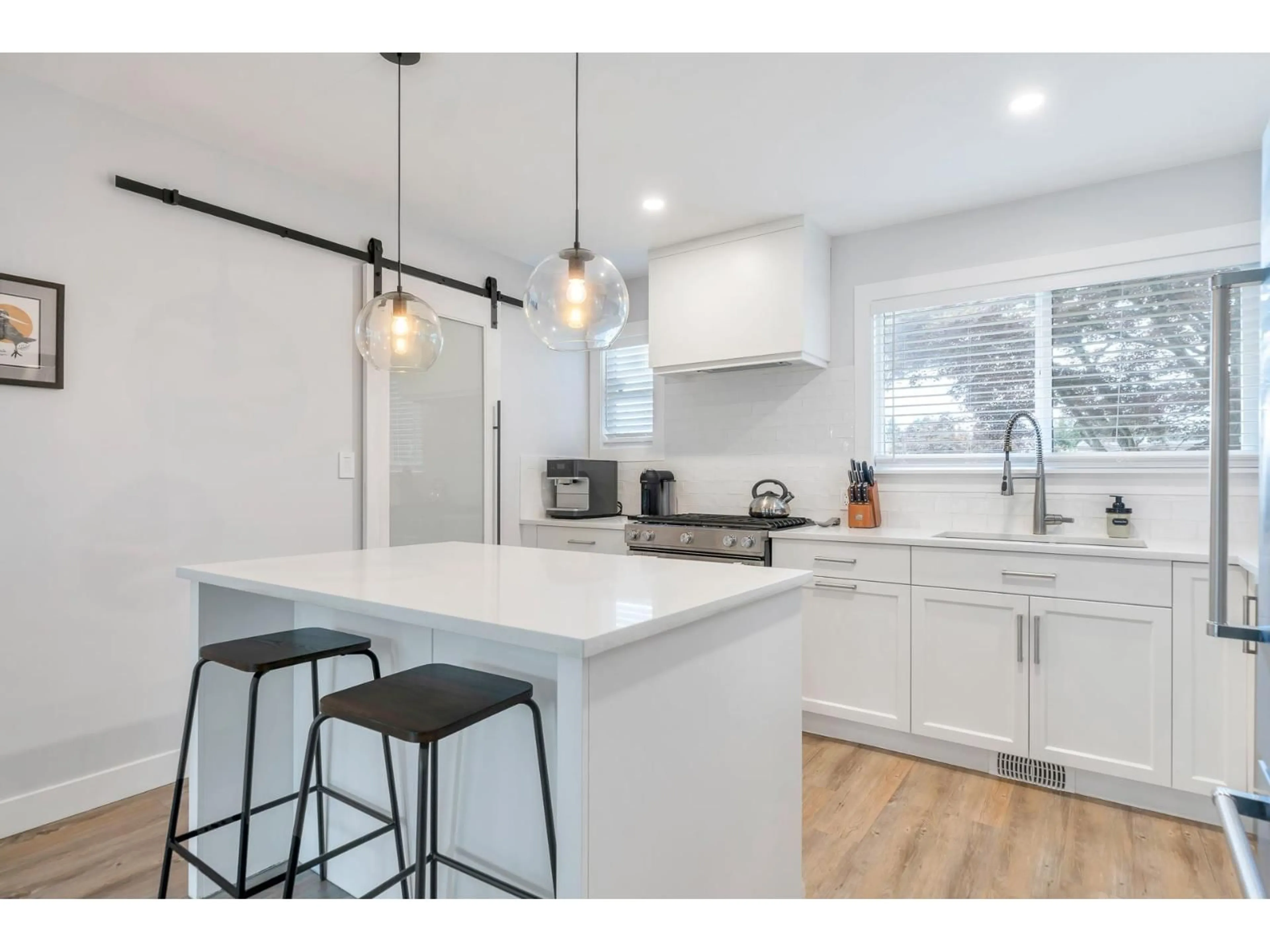 Open concept kitchen, wood/laminate floor for 9960 JONES DRIVE, Chilliwack British Columbia V4Z0A9