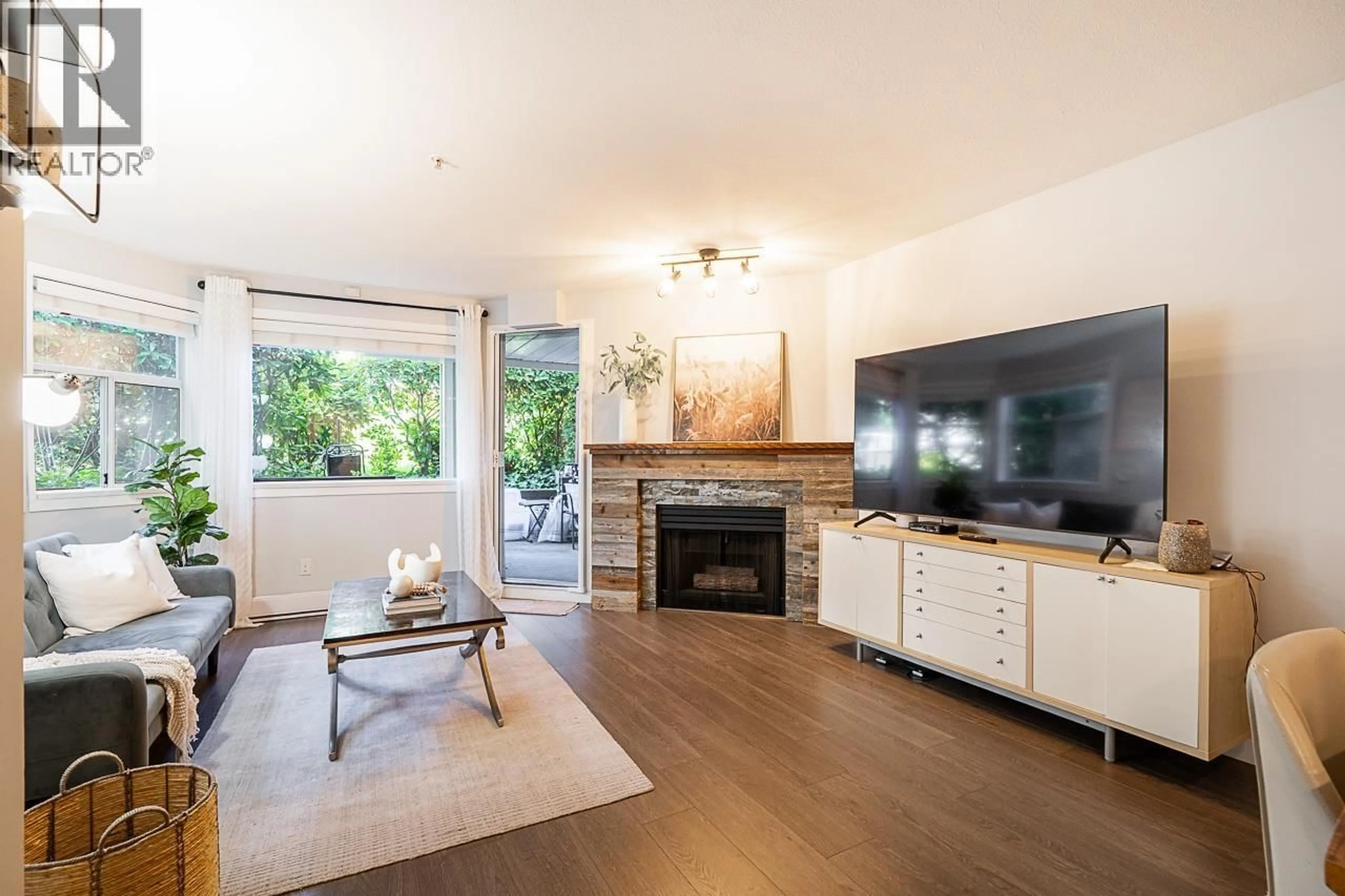 Living room with furniture, wood/laminate floor for 106 - 3628 RAE AVENUE, Vancouver British Columbia V5R2P5