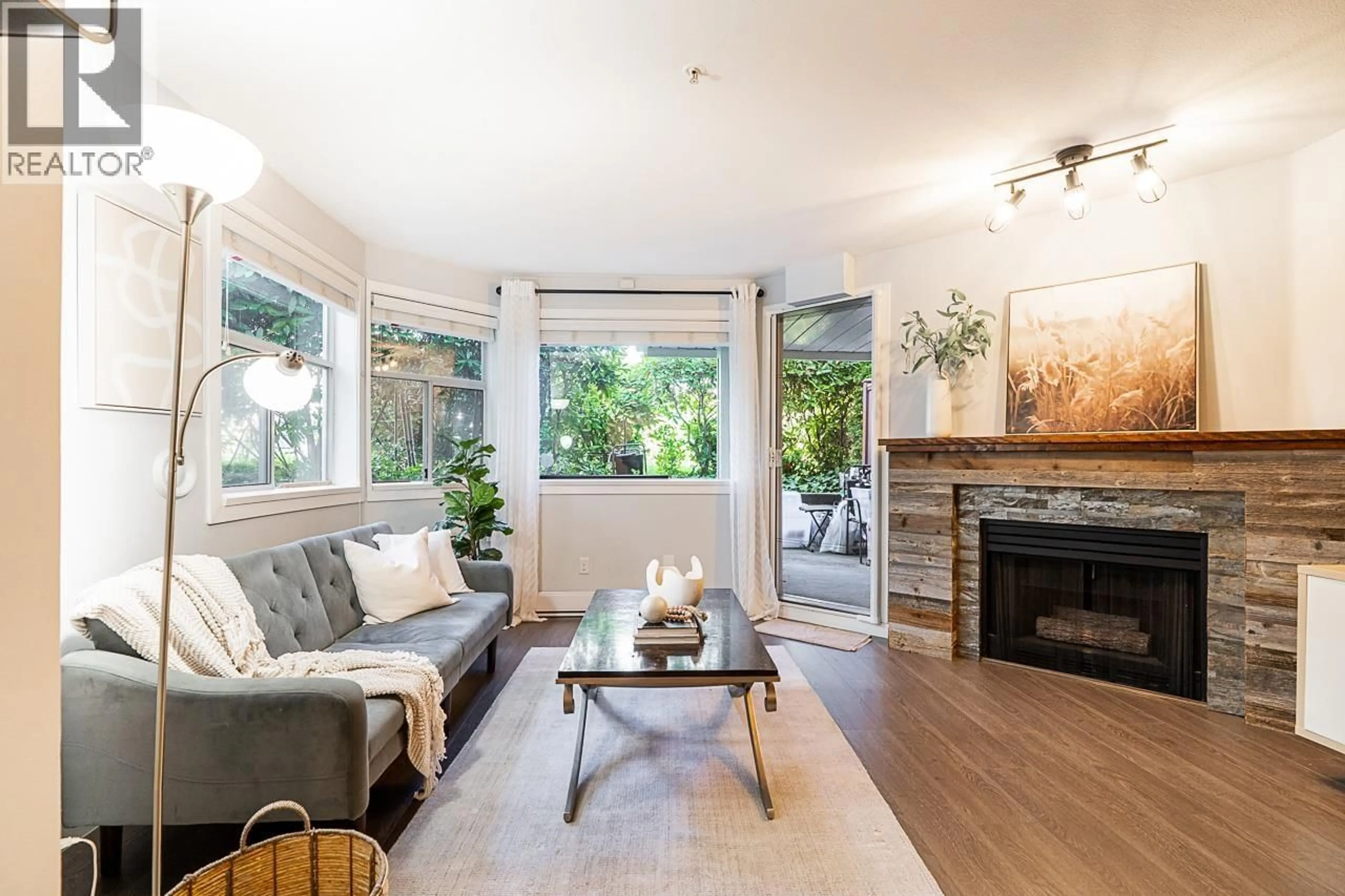 Living room with furniture, wood/laminate floor for 106 - 3628 RAE AVENUE, Vancouver British Columbia V5R2P5