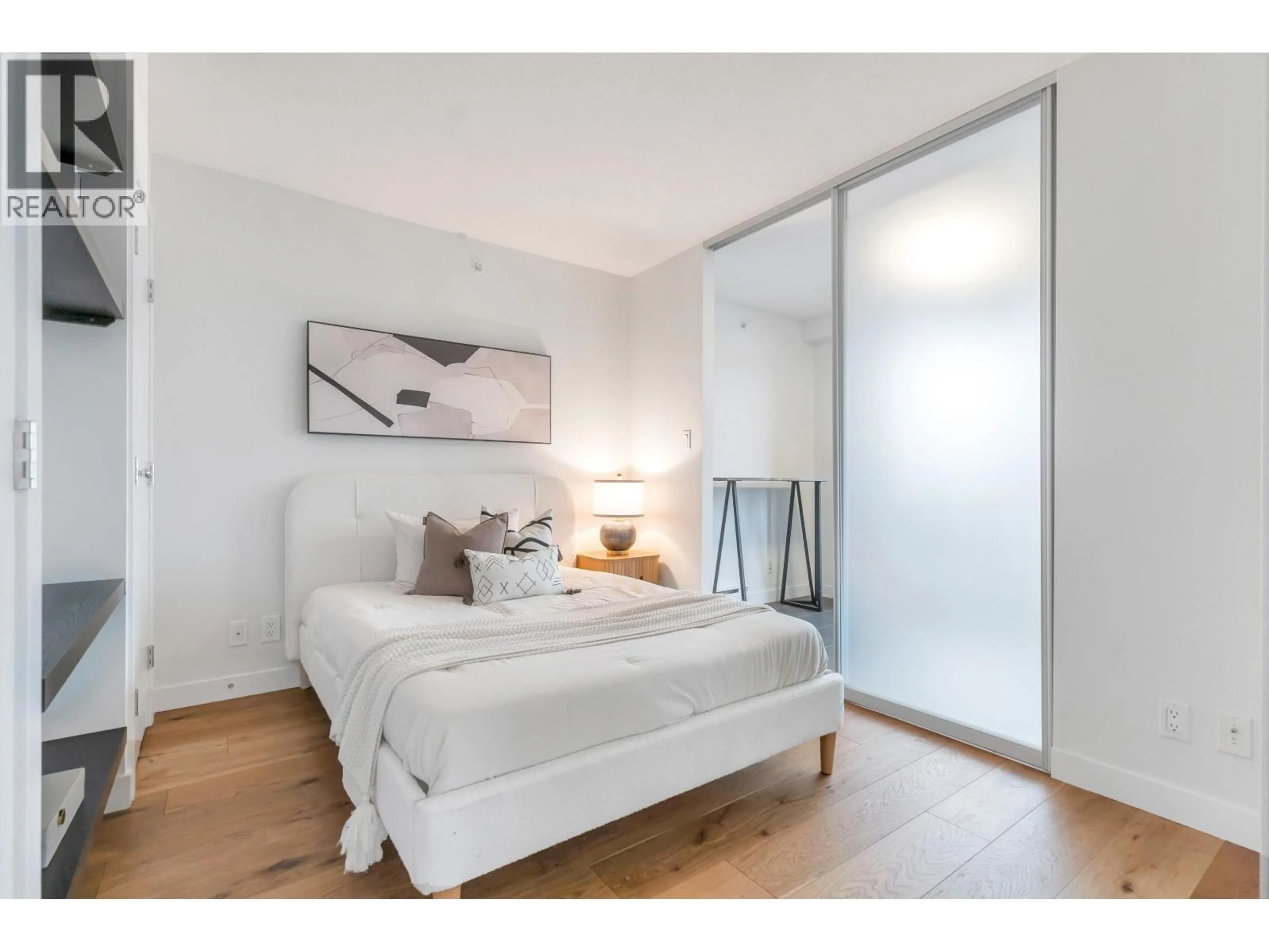 Bedroom with bed, wood/laminate floor for 1003 - 1055 HOMER STREET, Vancouver British Columbia V6B1G3