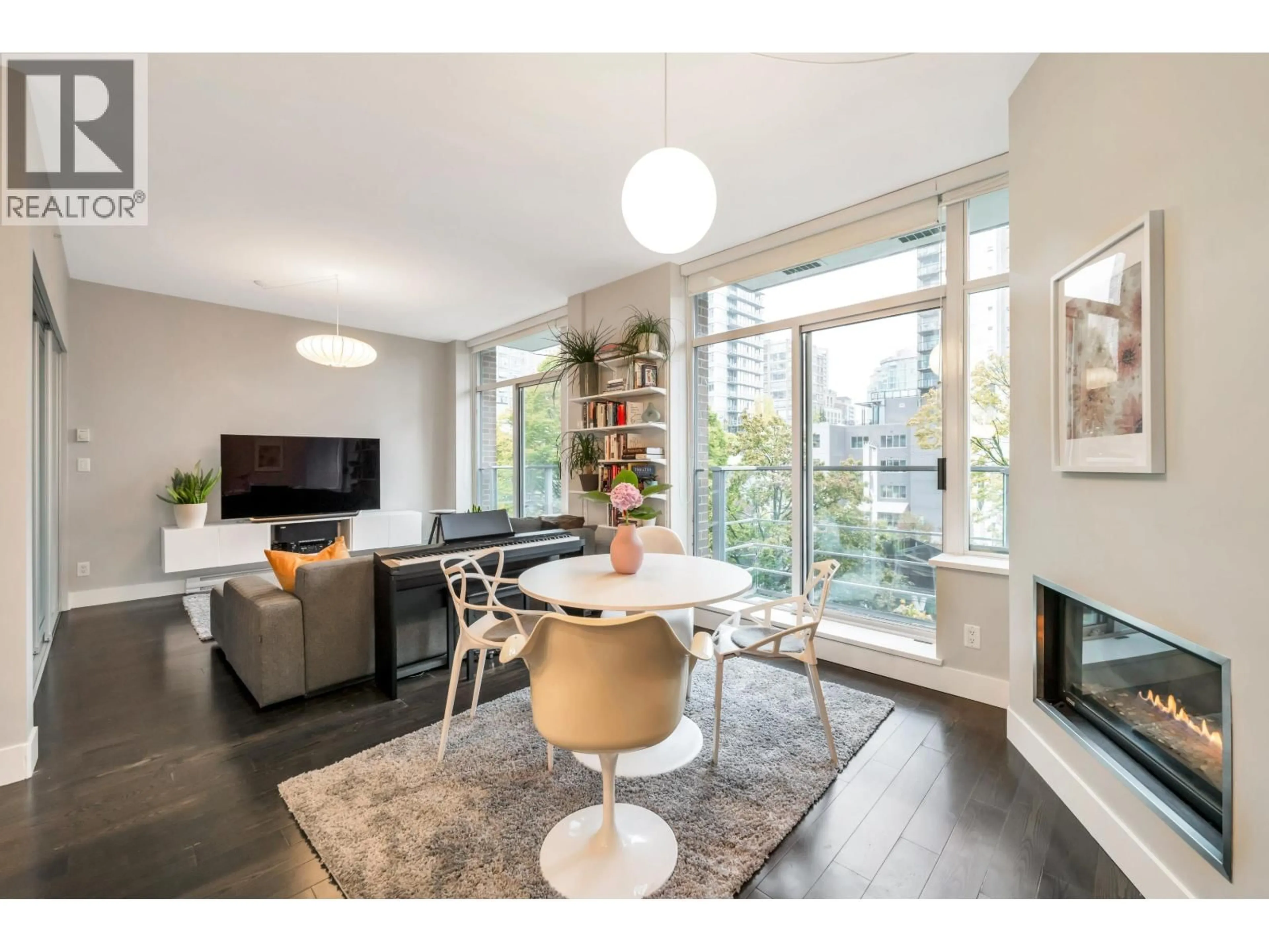 Living room with furniture, wood/laminate floor for 305 - 535 SMITHE STREET, Vancouver British Columbia V6B0H2