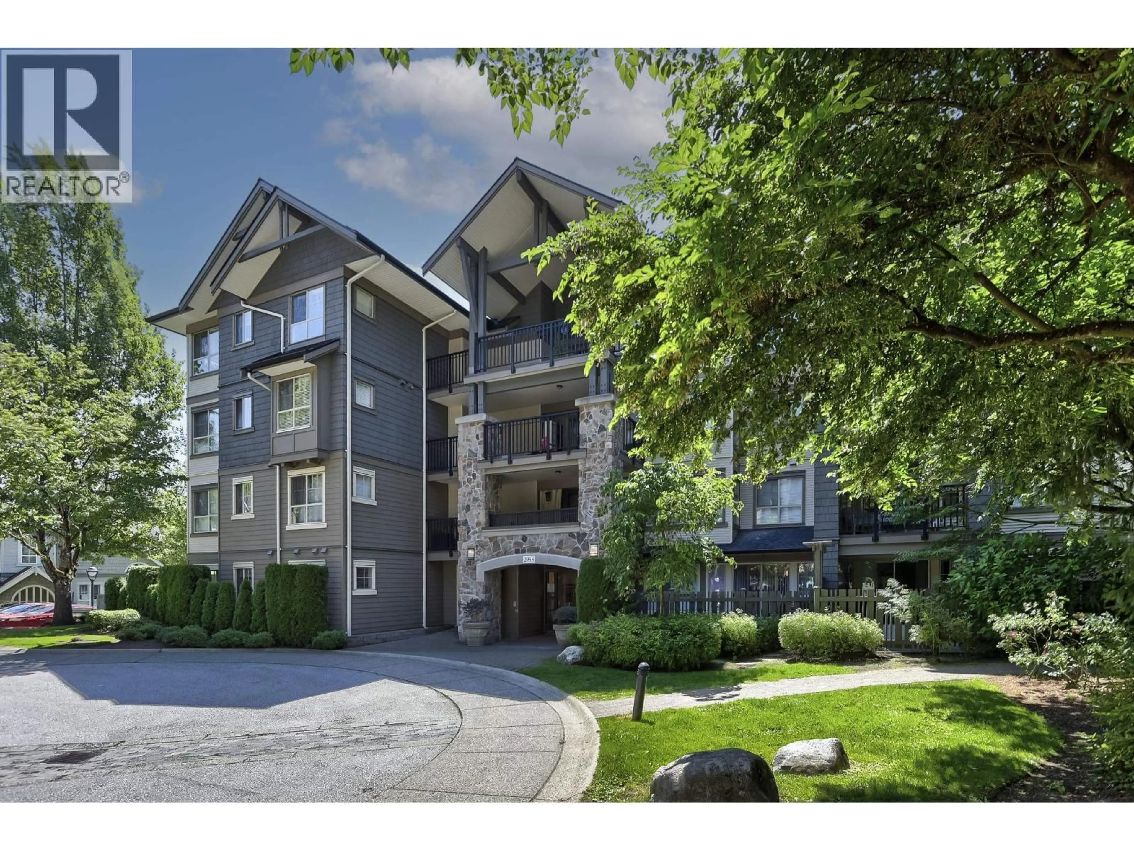 A pic from outside/outdoor area/front of a property/back of a property/a pic from drone, unknown for 205 - 2958 WHISPER WAY, Coquitlam British Columbia V3E3S7