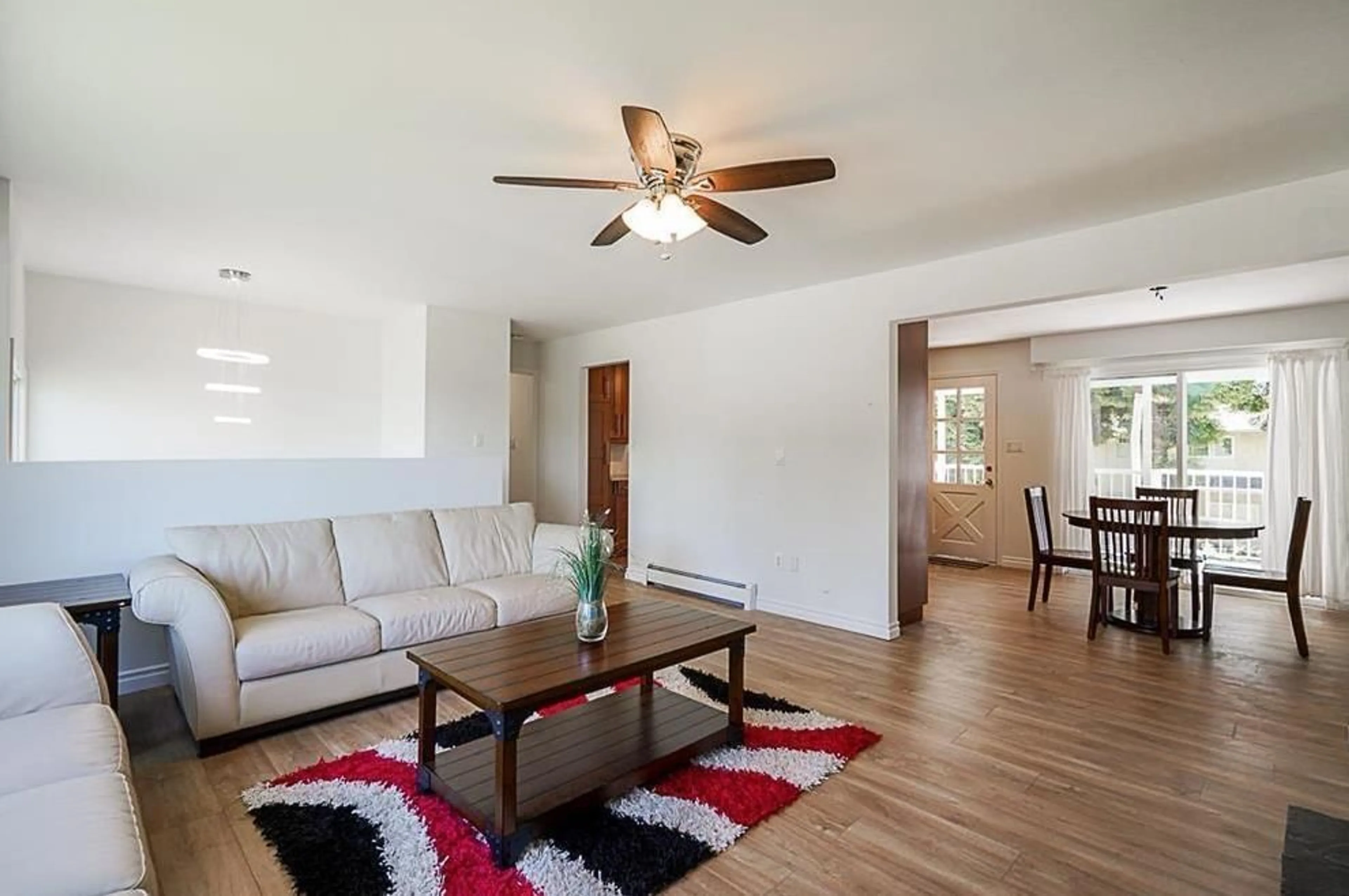 Living room with furniture, wood/laminate floor for 15084 86A, Surrey British Columbia V3S4V1